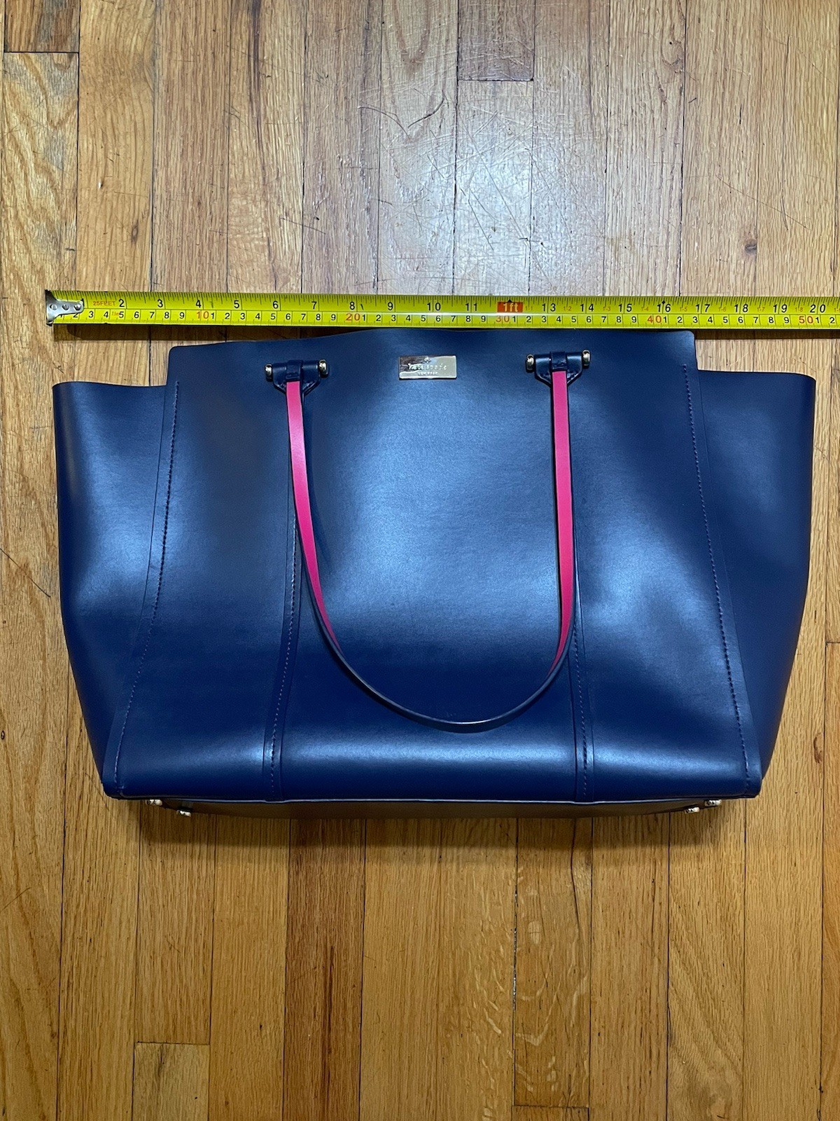 Kate Spade Arbour Hill Elodie leather tote bag in navy blue with a pink interior