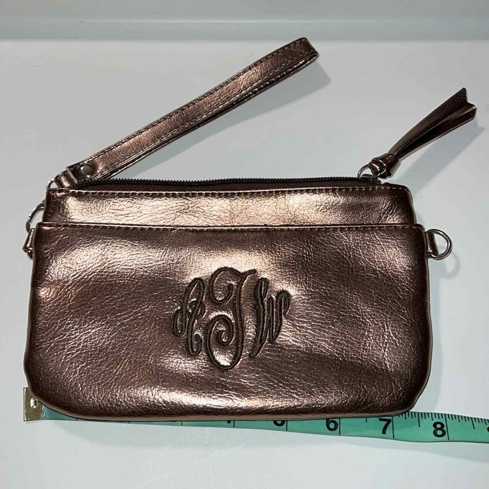 “AWT” initials copper wristlet detachable strap zip top inside pockets