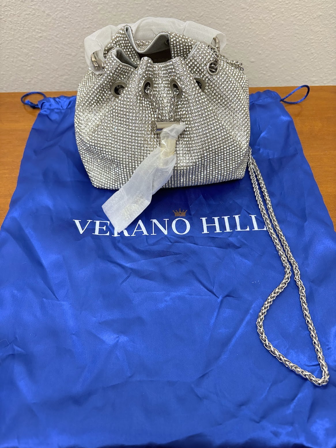 Verano Hill silver rhinestone embellished bucket bag with a chain strap