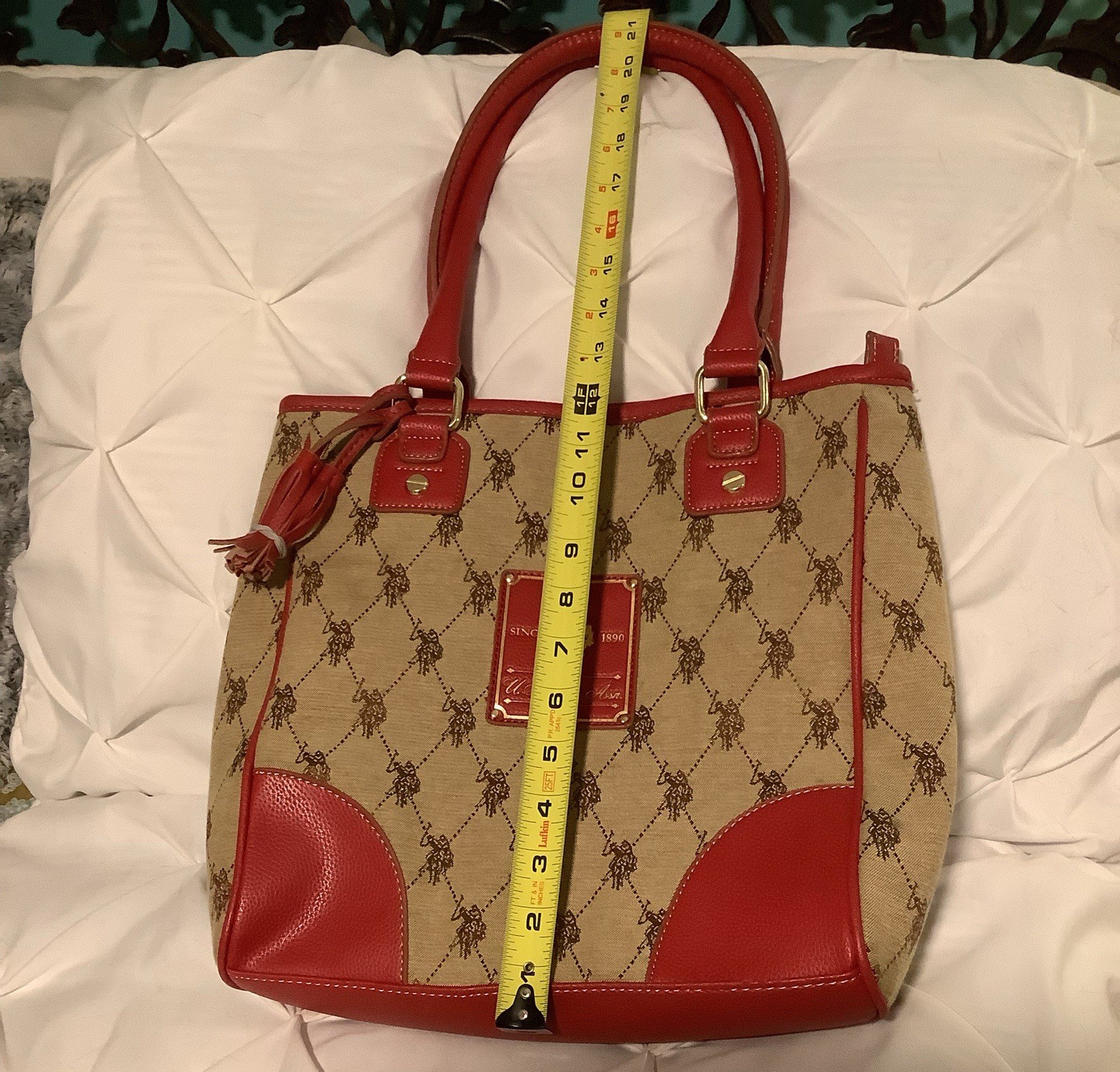 Polo Assn. cotton-blended logo fabric shoulder bag w/red vinyl trim and handles.