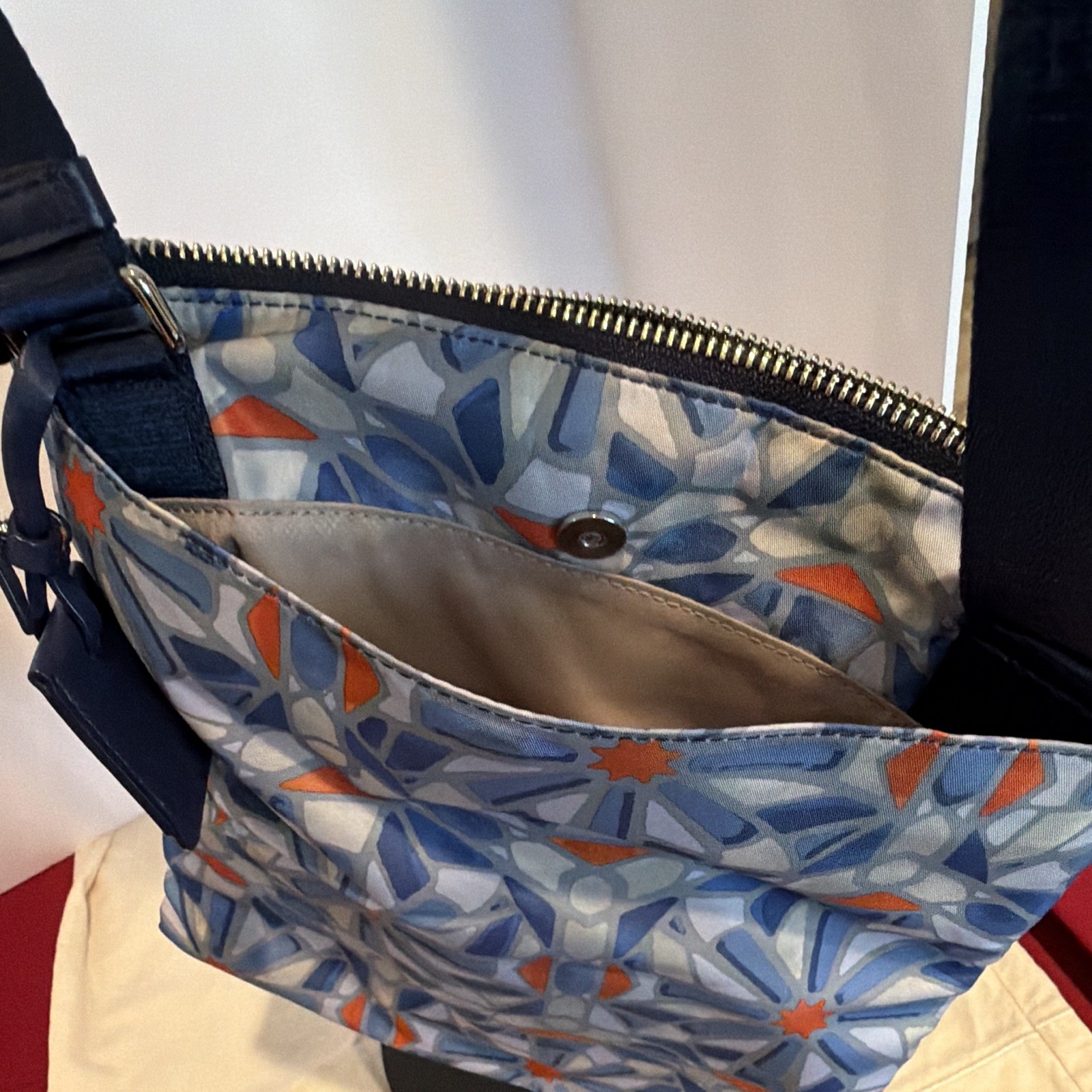TUMI Blue Orange Geometric Crossbody Bag Adjustable Strap Lined Pockets Zip