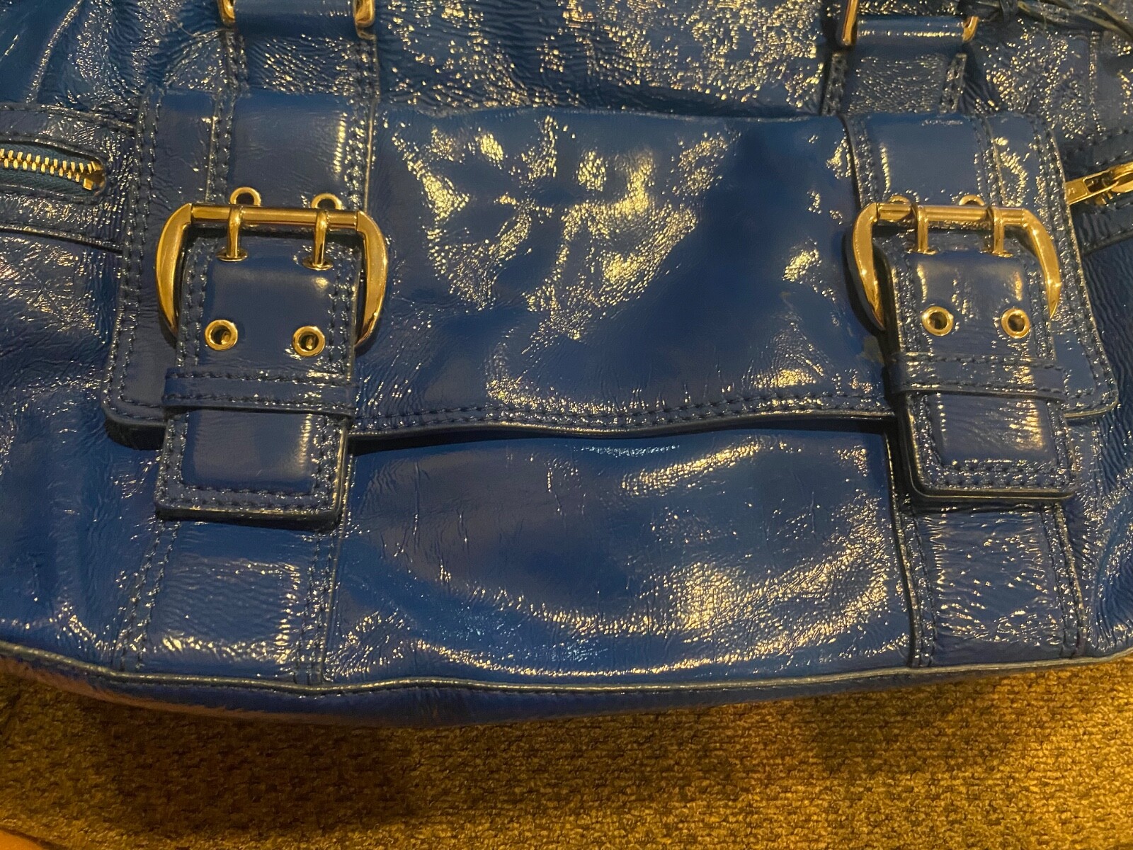 Michael Kors metallic blue, large purse with buckles it 11 inch in heightl