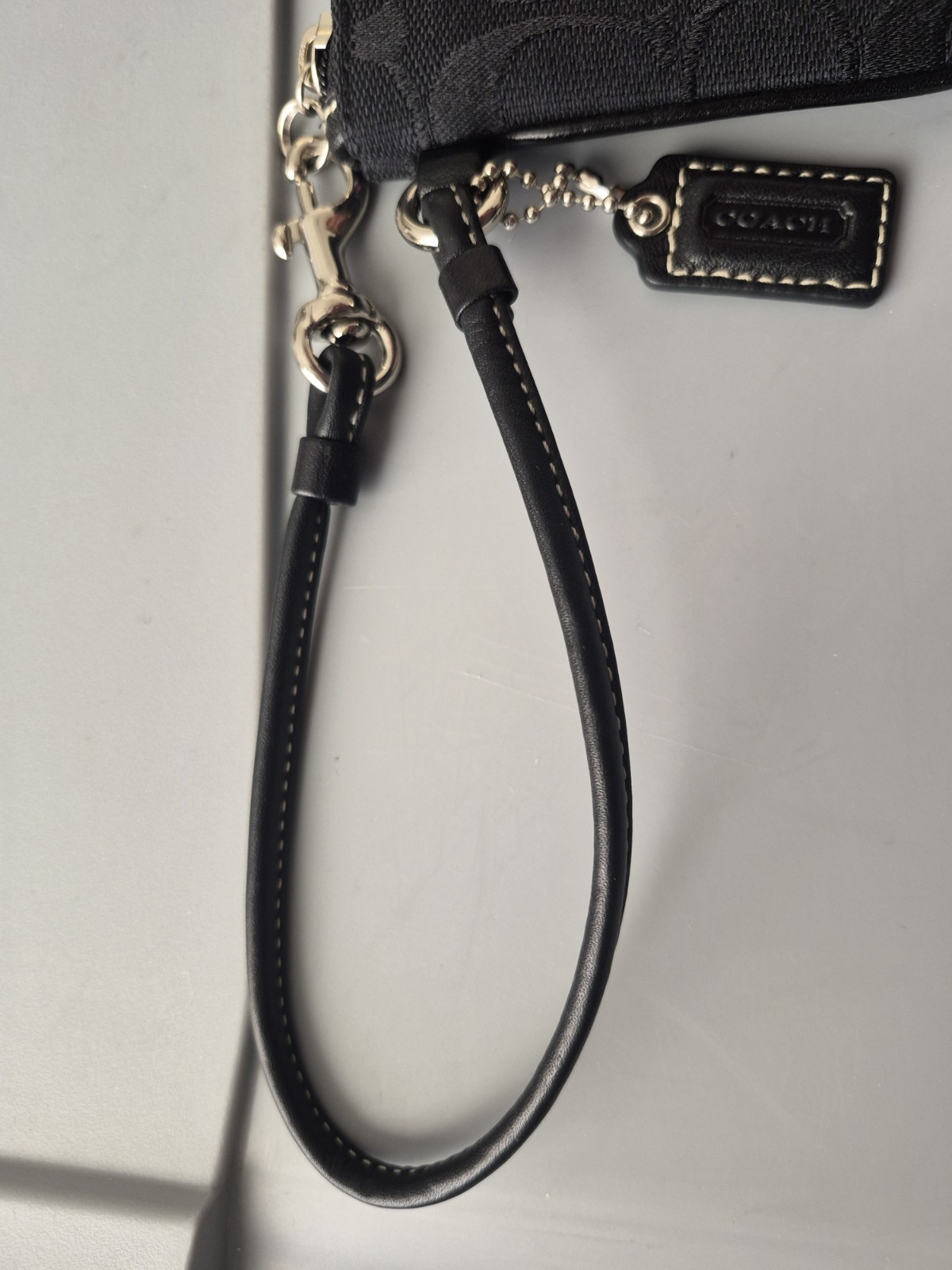Brand new black/gray signature coach wristlet