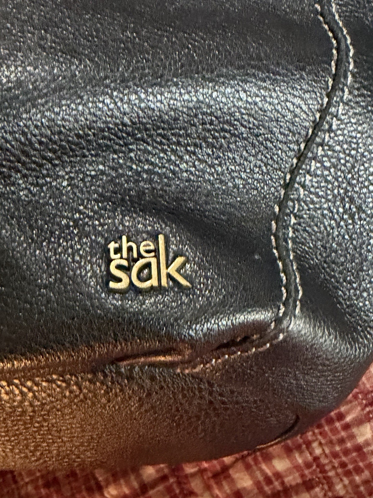 The Sak Black Pebbled Crescent Shoulder Bag Zip Top Multicolor Lining Charm