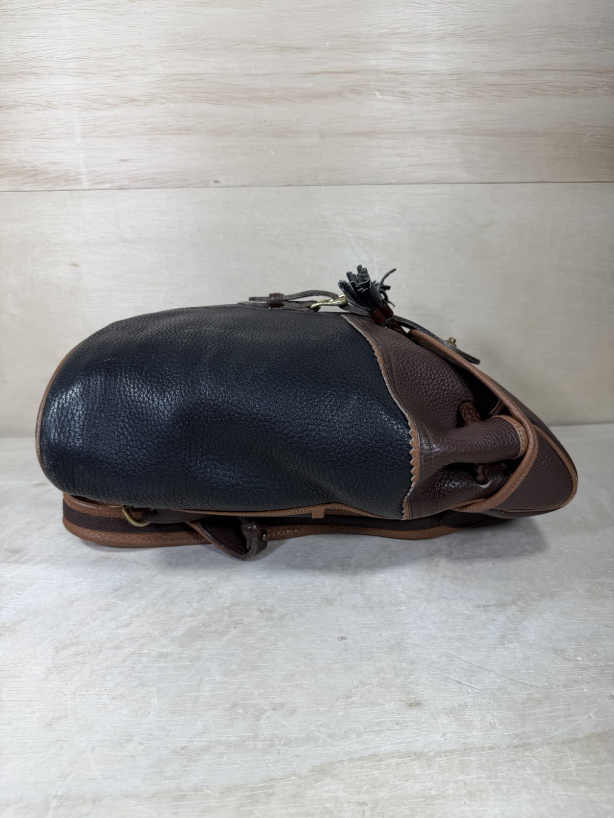 Vintage Dooney & Bourke Black Brown Pebbled Leather Drawstring Backpack Tassels