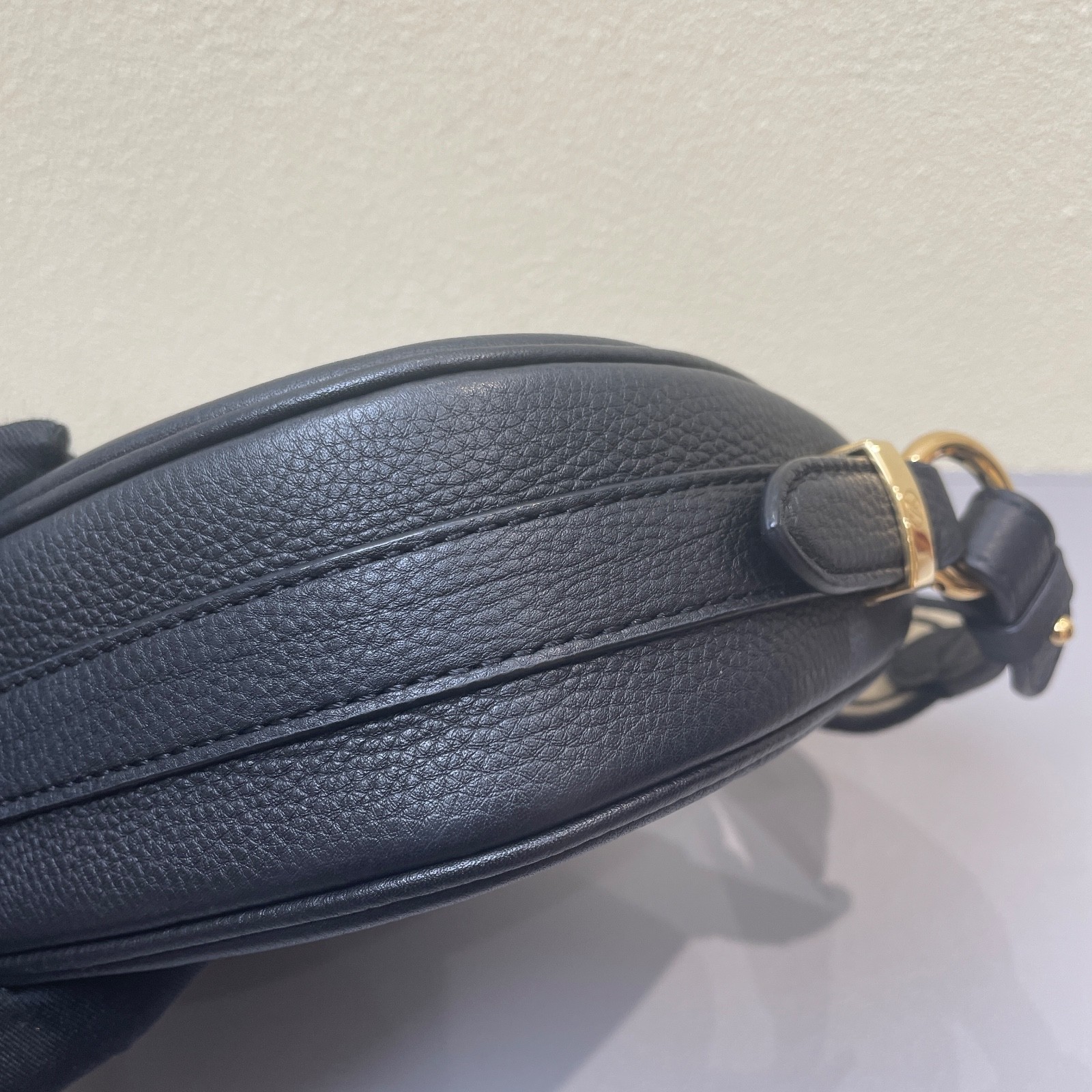 Louis Vuitton Pont 9 black calfskin crossbody bag with gold-tone hardware.