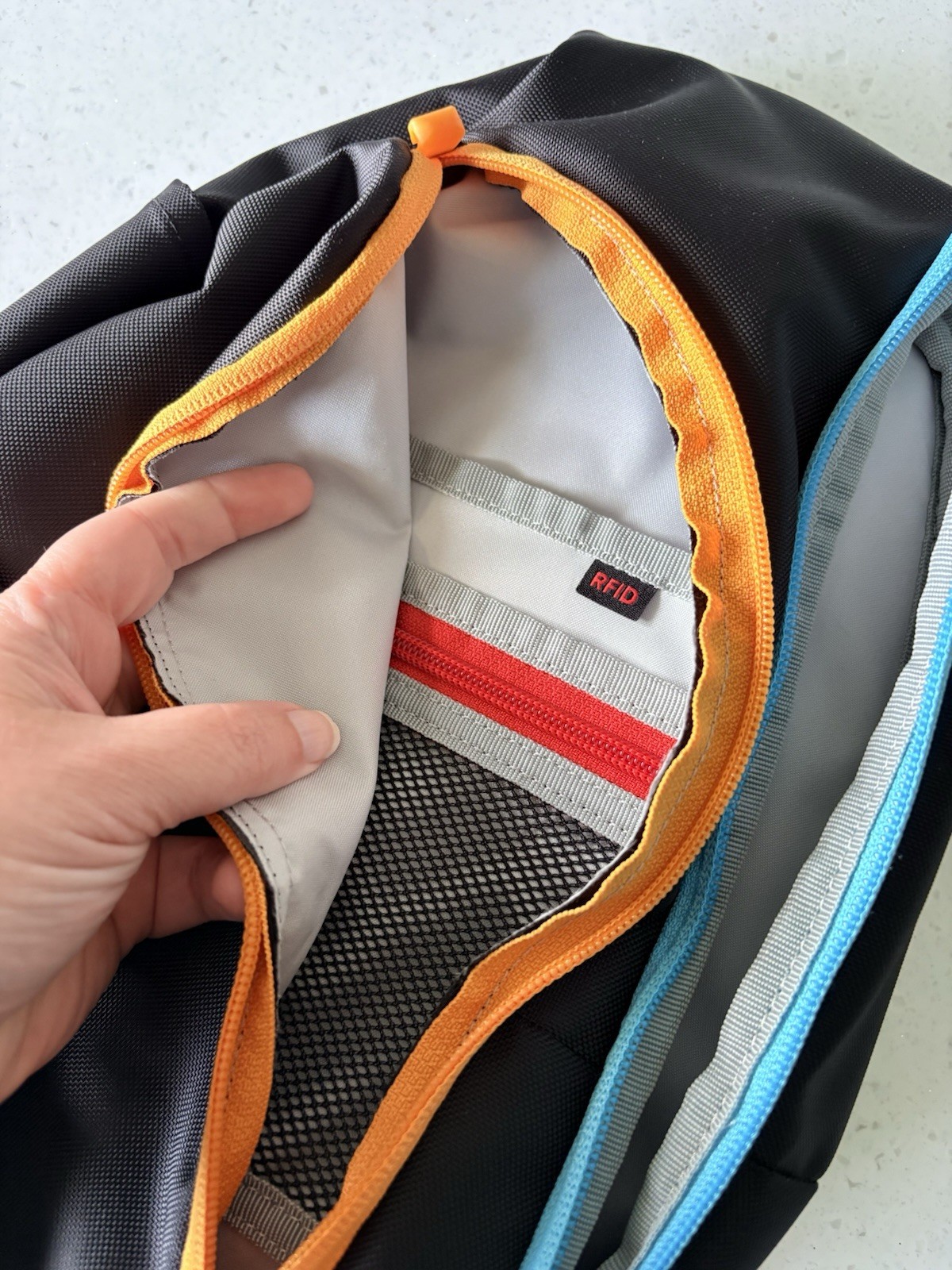 Sherpani Sling Bag RFID Blocking, Black w/ Blue & Orange Zippers, Travel