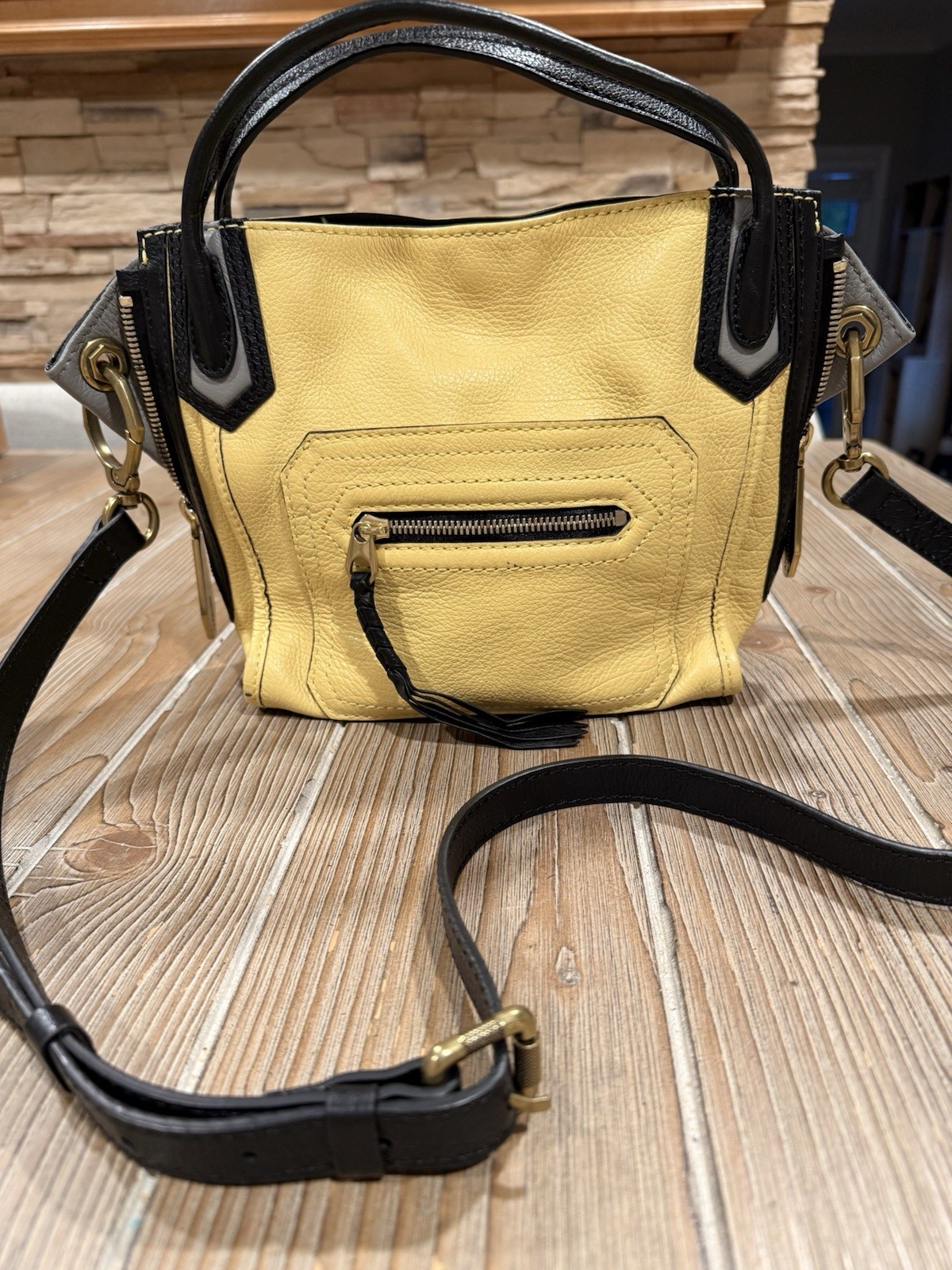 orYANY Mini Ruby Convertible Crossbody Bag in a striking yellow, black, and gray