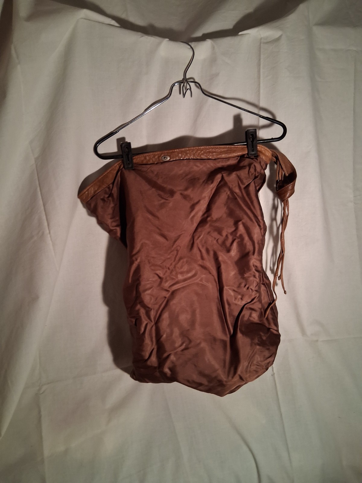 Chestnut supple leather saddlebag. 10″ high with flap closed. 16″ wide.