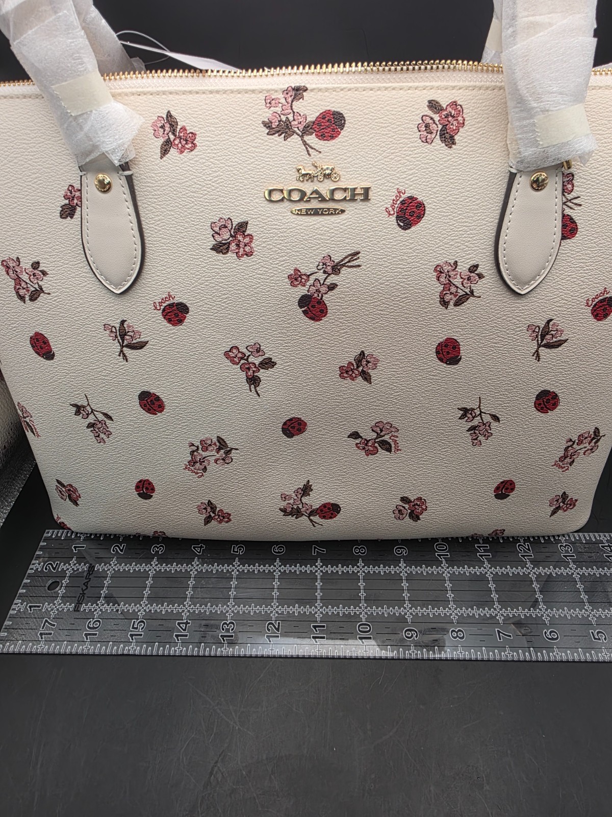 NEW COACH GALLERY TOTE WITH LADYBUG FLORAL PRINT (SCUFF MARKS BACK)