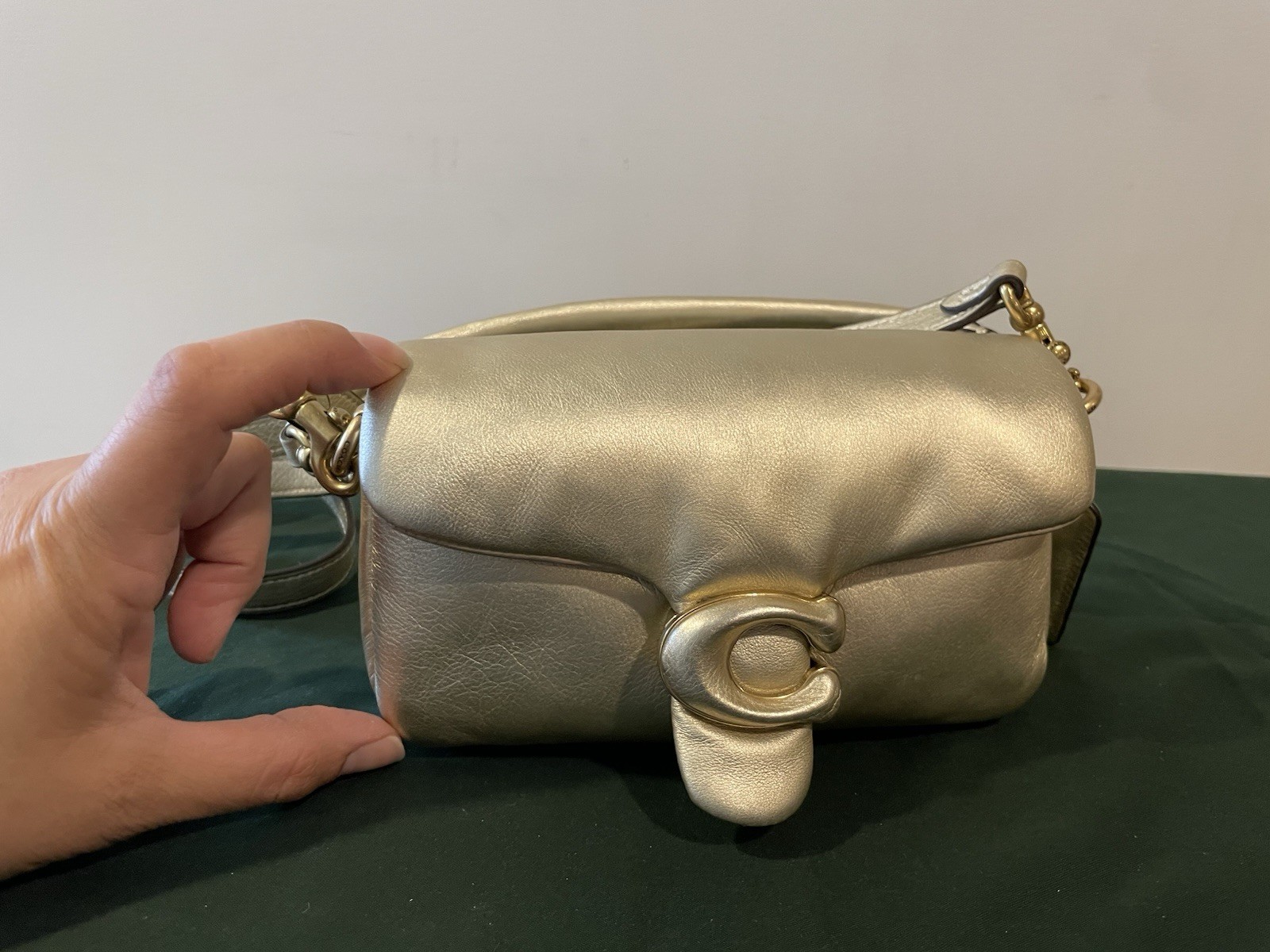 Coach Pillow Tabby 18 in a metallic gold leather finish