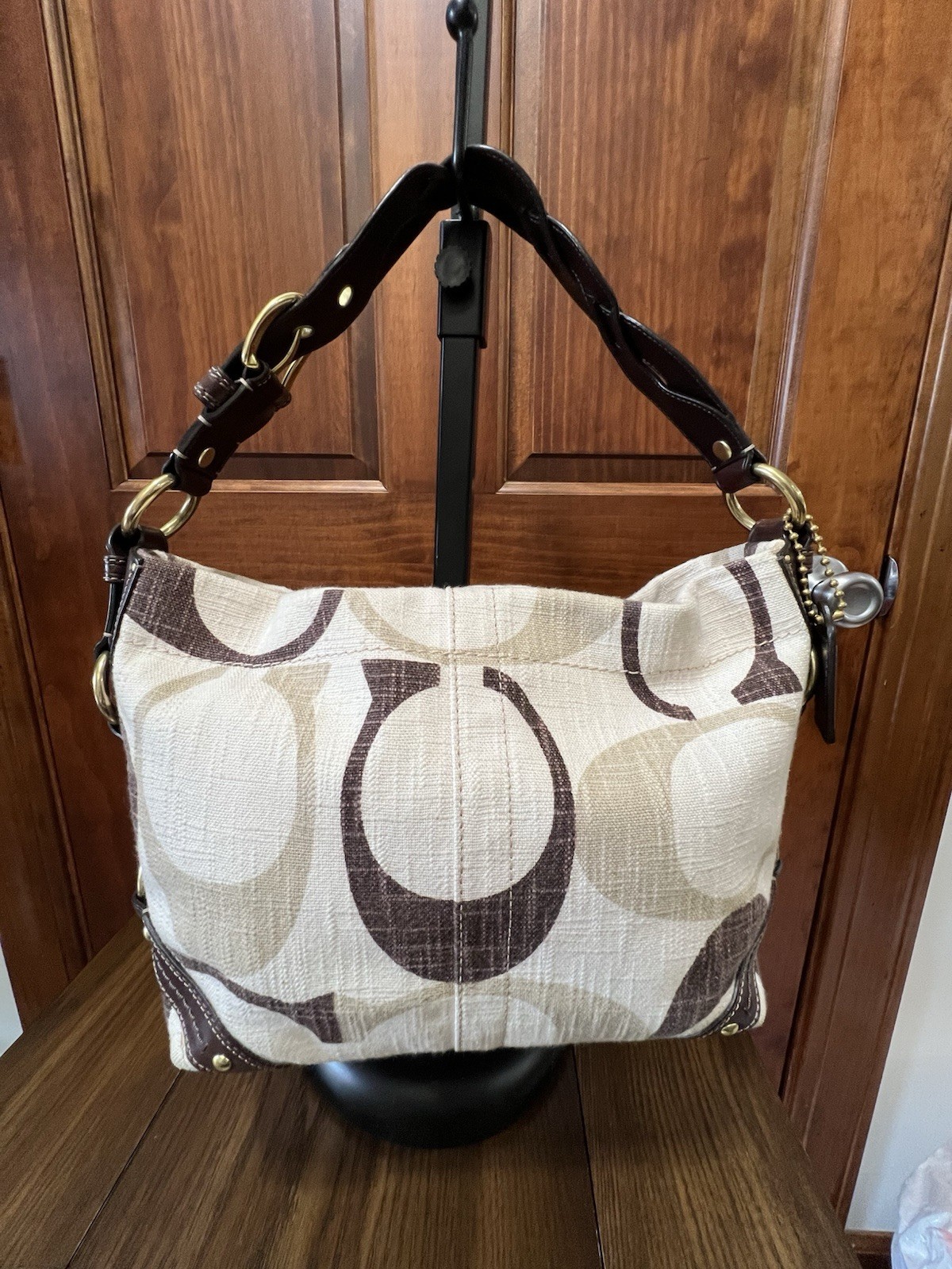 Coach Signature Medium sized Carly with matching wallet.