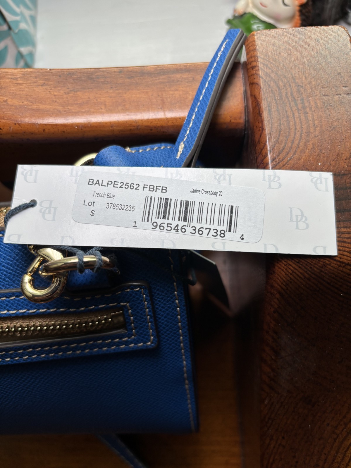 Dooney & Bourke Pebbled Leather Small Janine Crossbody in the color French Blue.