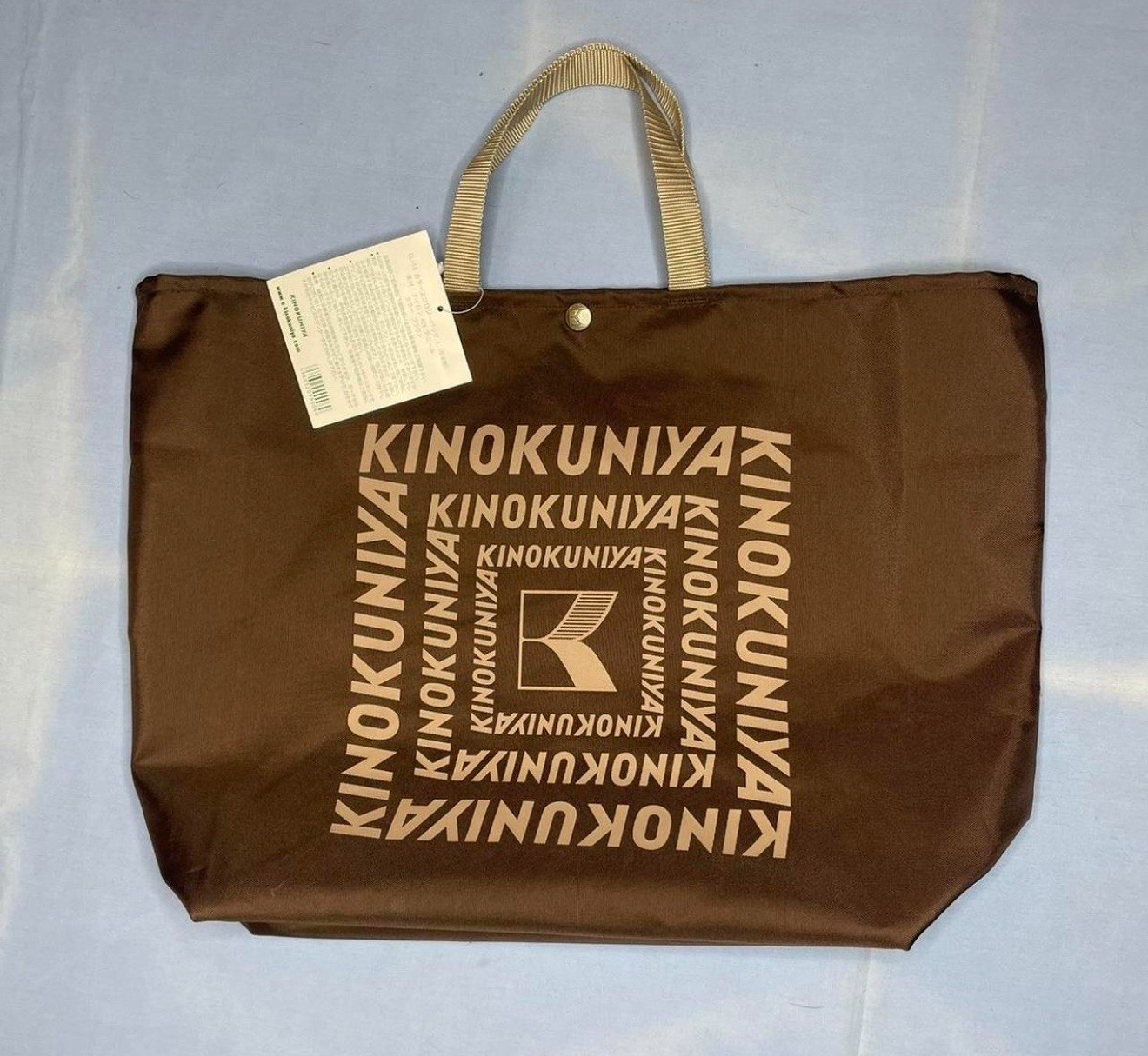Brown and tan Kinokuniya tote bag One size fits most