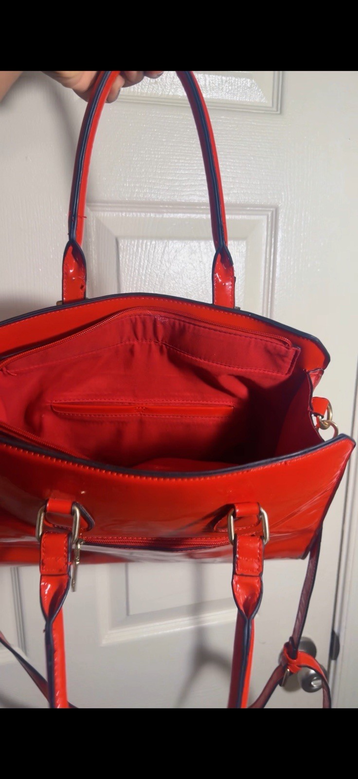 Beautiful red leather handbag with gold hardware. Spacious, stylish, and perfe