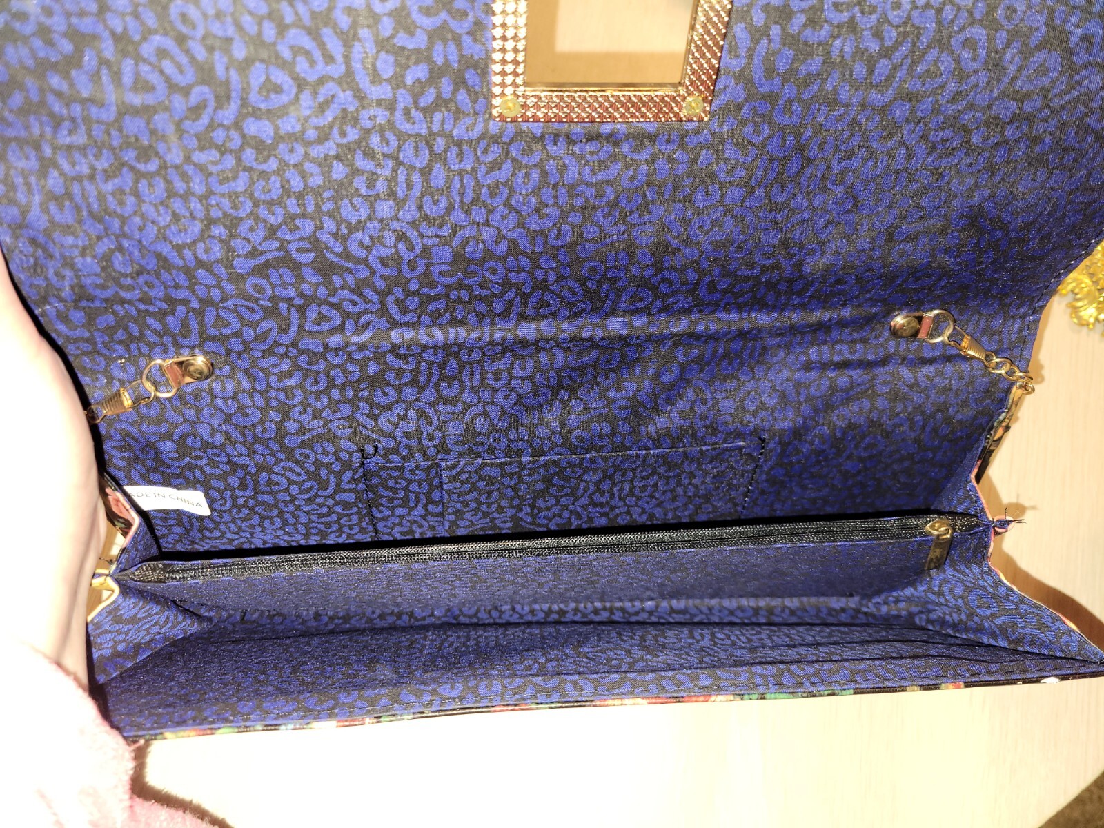 Large! About 15″ long. Very pretty vintage floral clutch on a removable chain.