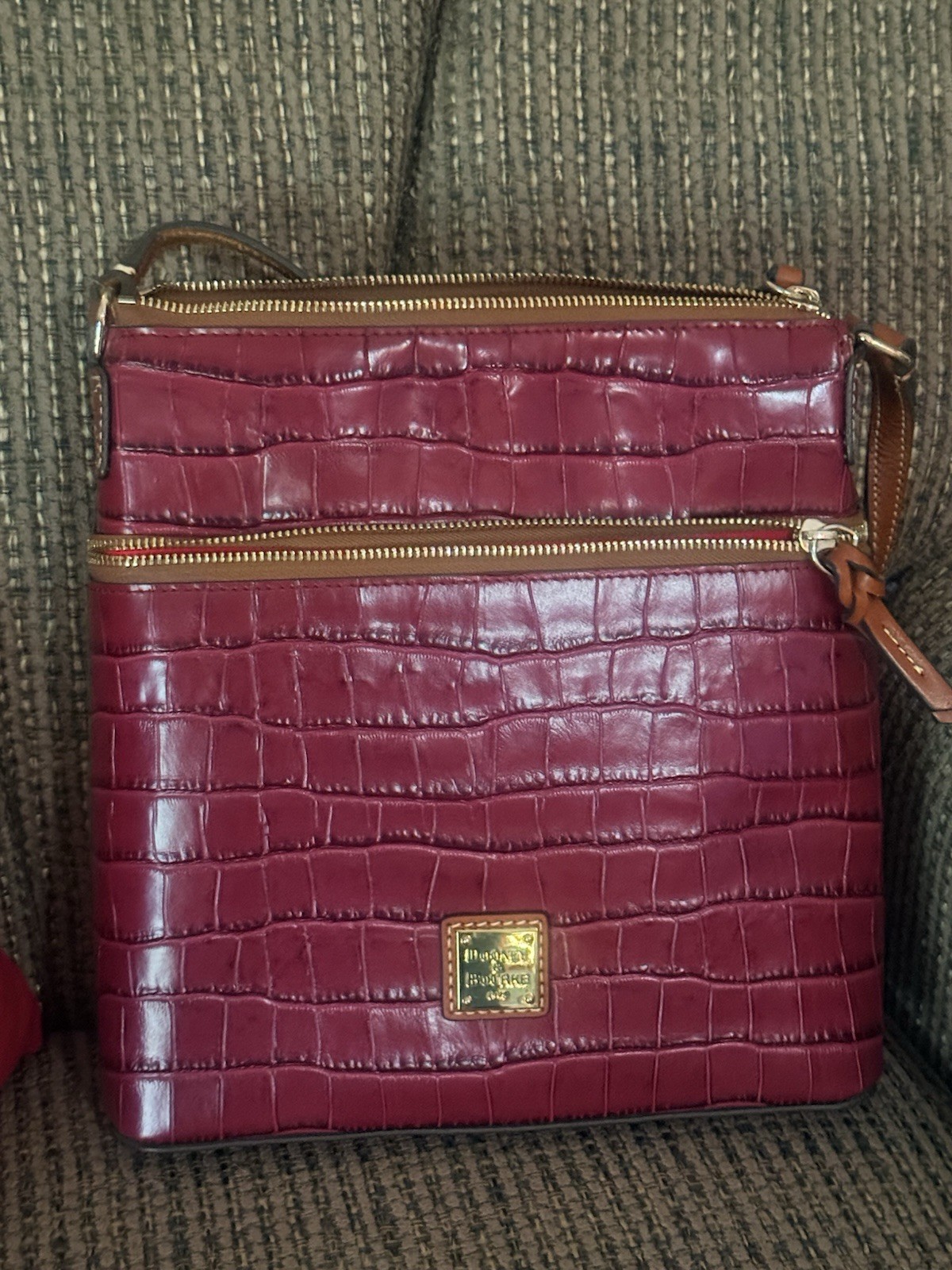 Dooney & Bourke Burgundy Embossed Crossbody Bag Zip, Pockets, Brown Strap