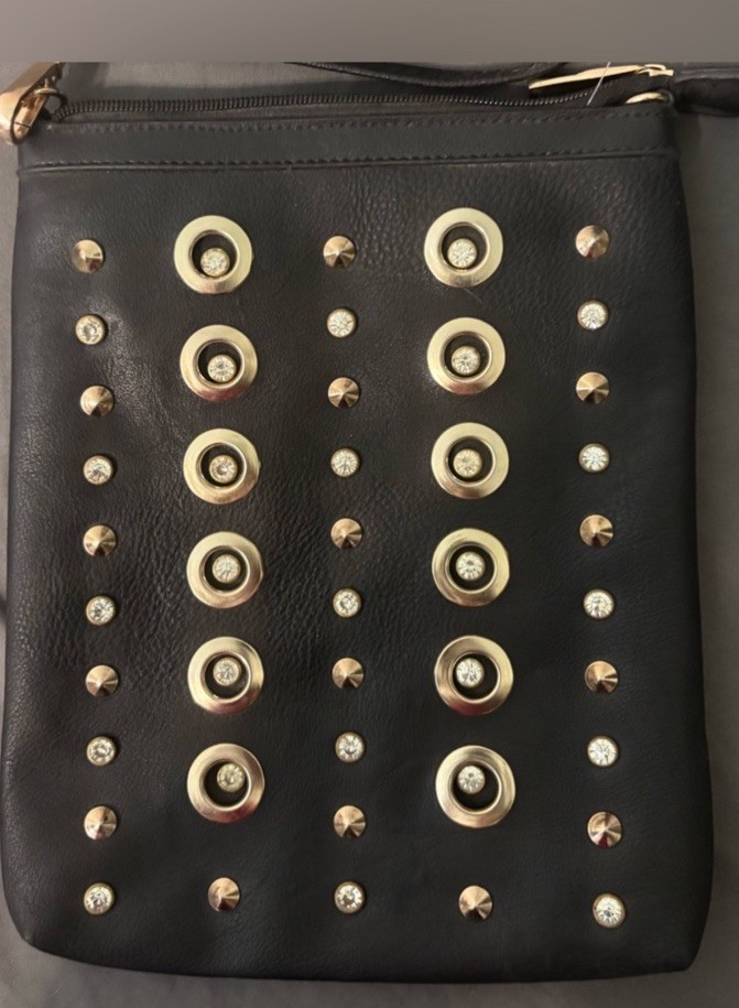 Black Studded Leather Clutch with Gold Grommets said to be a 1990s fossil bag
