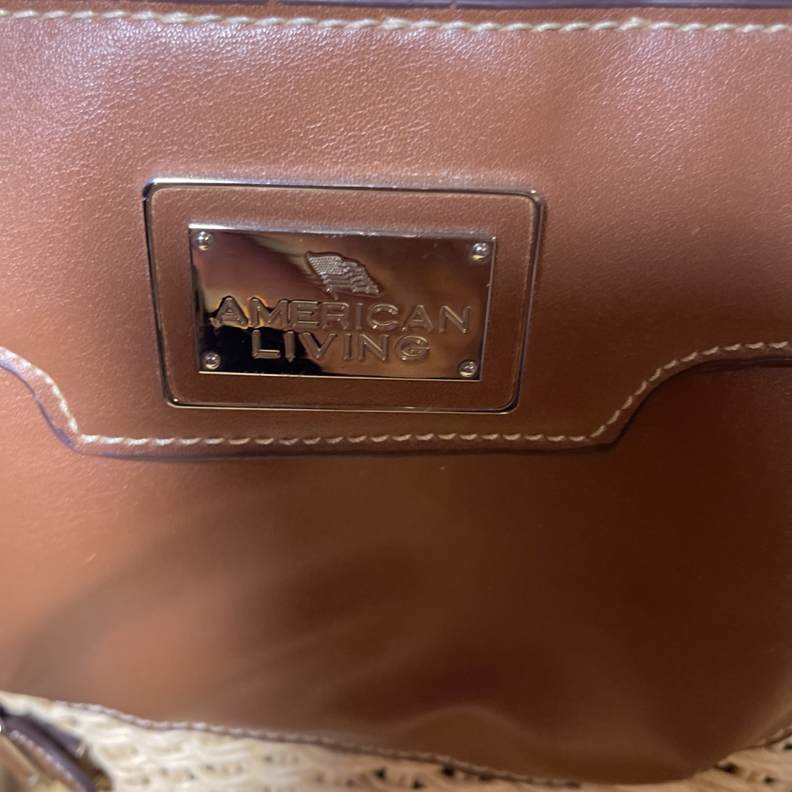American Living Co large straw shoulder purse with brown trim and outside pocket