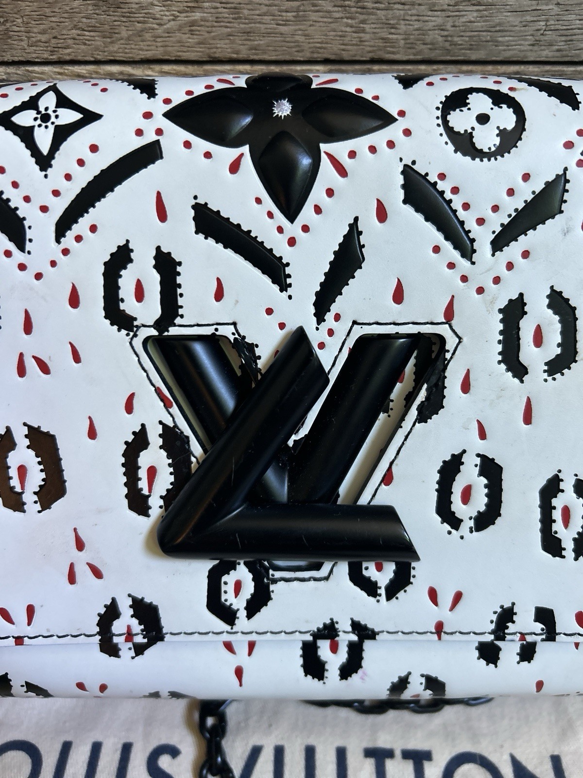 LOUIS VUITTON “Twist” black white red graphic print leather MM handbag