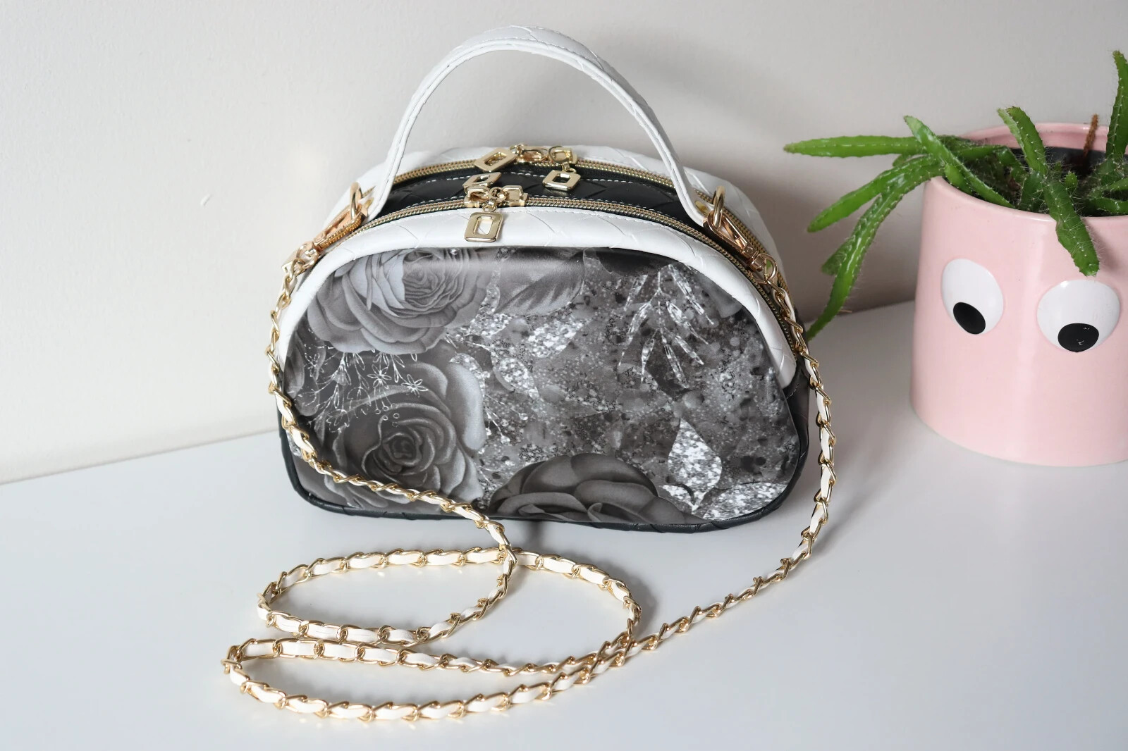 Small handbag with 2 separate compartments. Classy black & white floral print