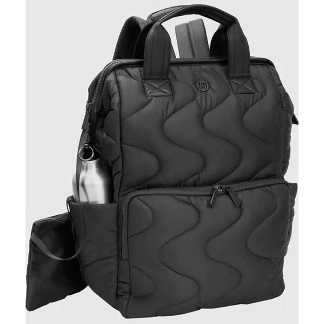 Joan and David black quilted nylon backpack with wave pattern and top handles