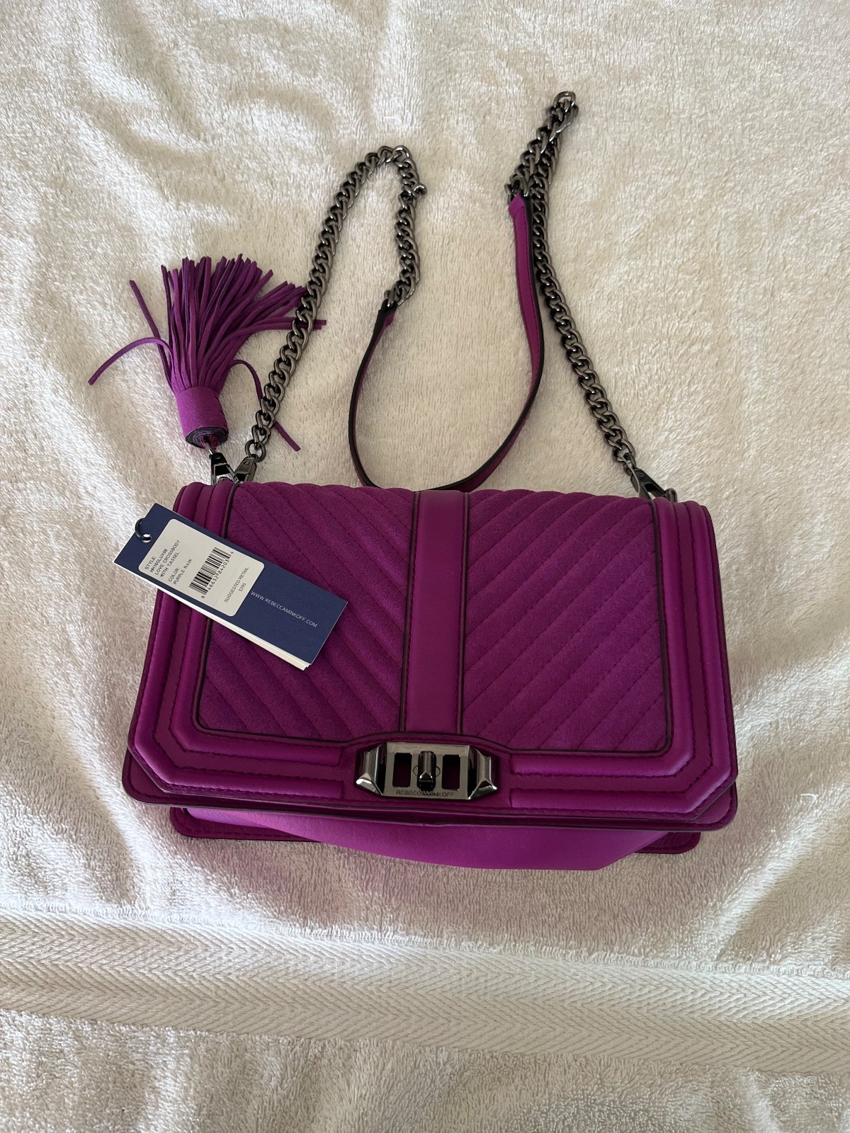 Rebecca Minkoff pocketbook crossbody with tassel purple rain color