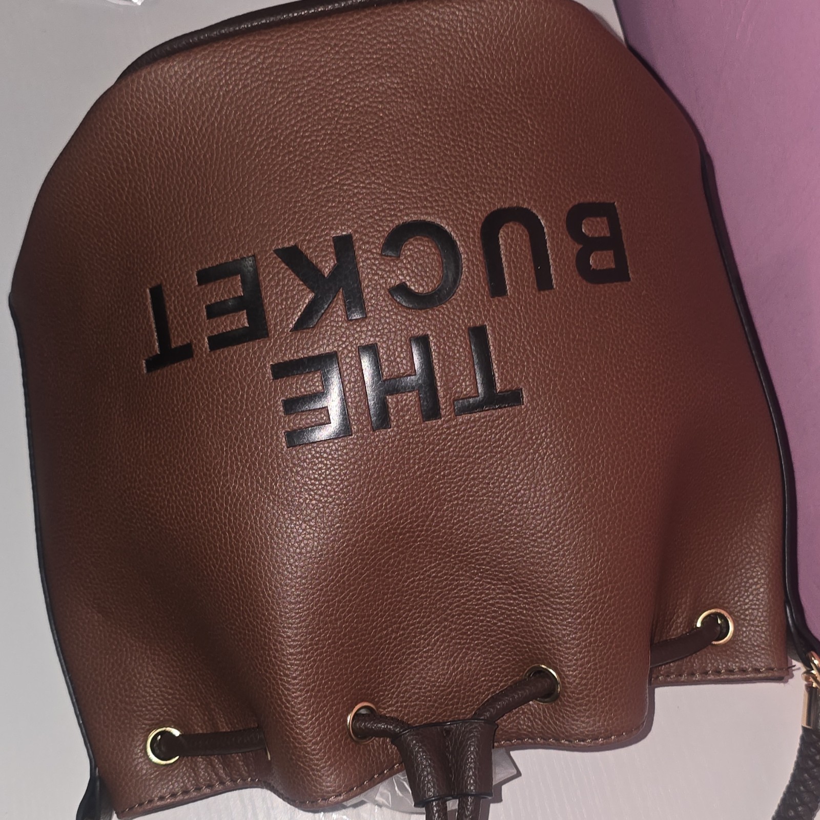 Women’s Brown Pebbled Bucket Drawstring Bag Gold Hardware Logo Grommet Strap