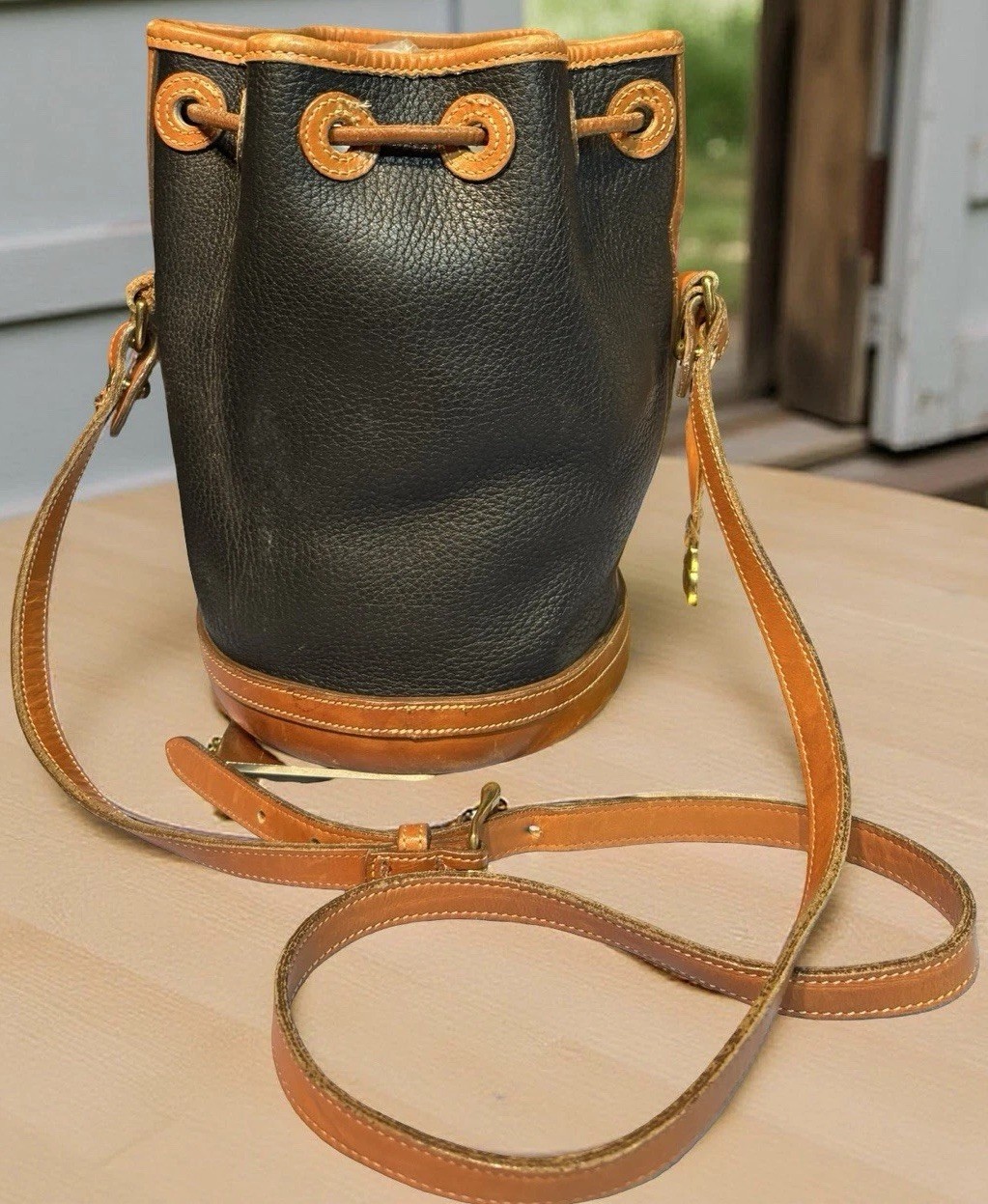 Dooney Bourke Black Vintage Drawstring Bucket Cylinder Bag All Weather Leather