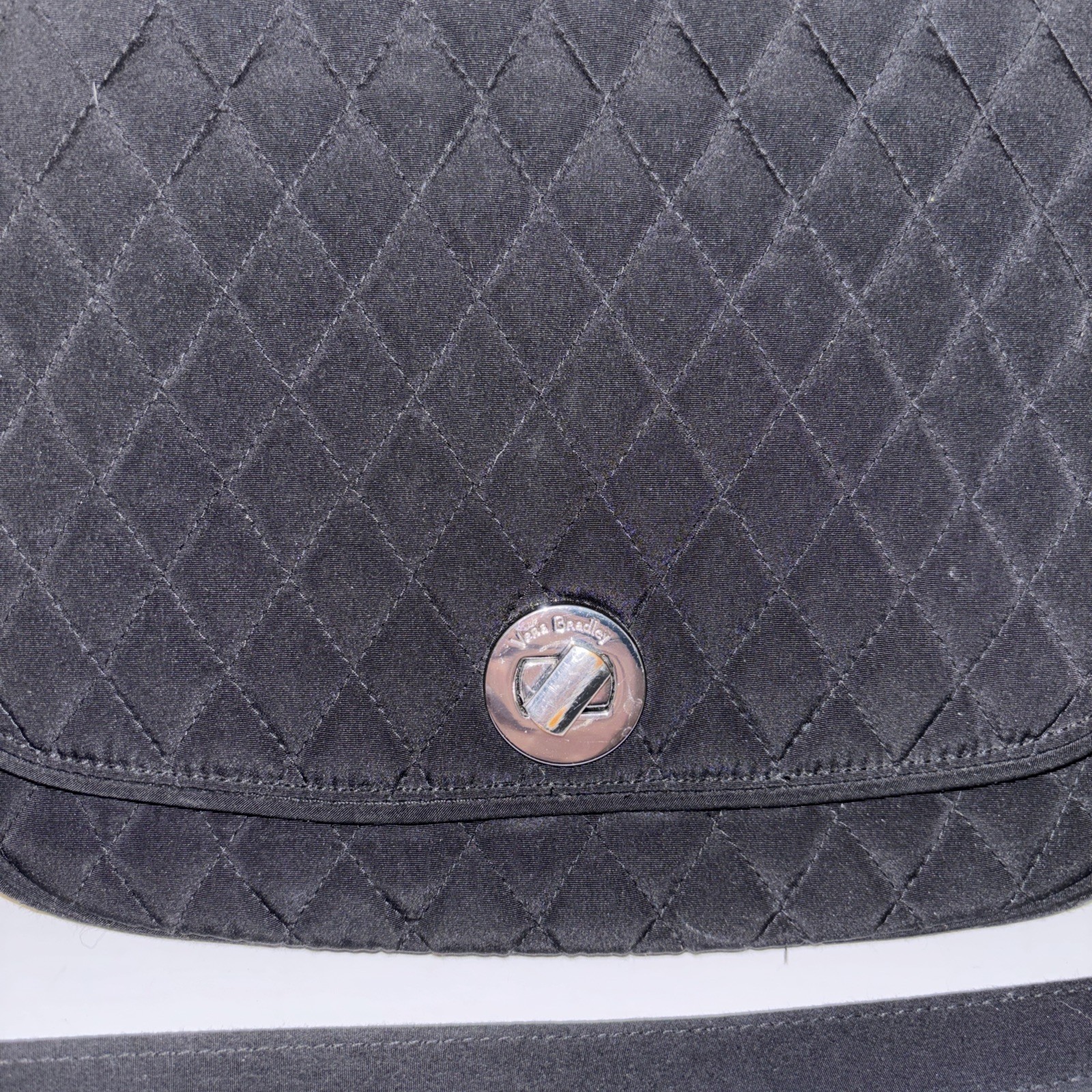 Vera Bradley black quilted crossbody bag,turn-lock closure on the front flap