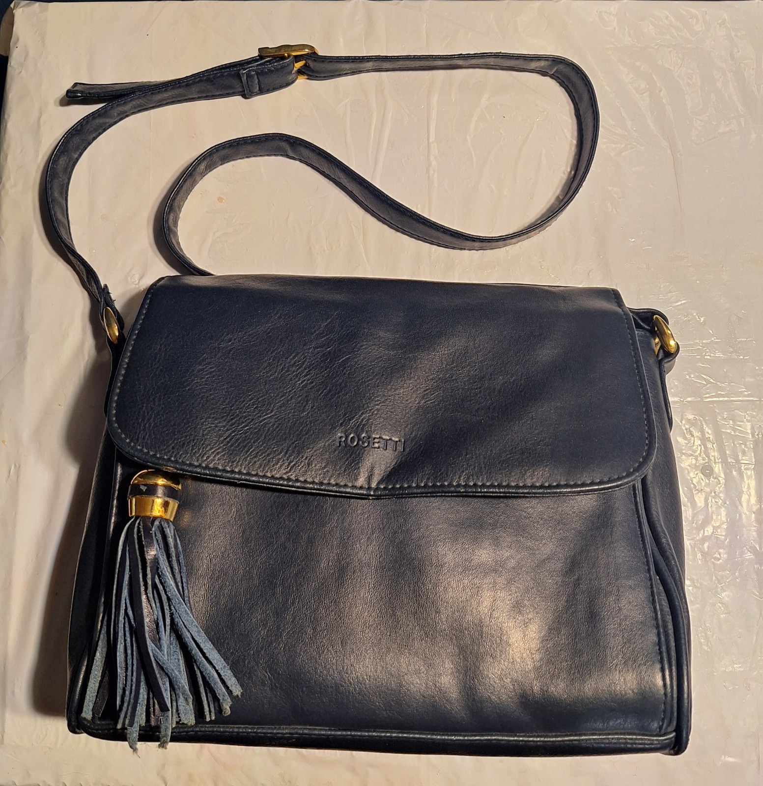 Rosetti Women’s Purse Satchel Black Vinyl Bag With Tassle, And Shoulder Strap.