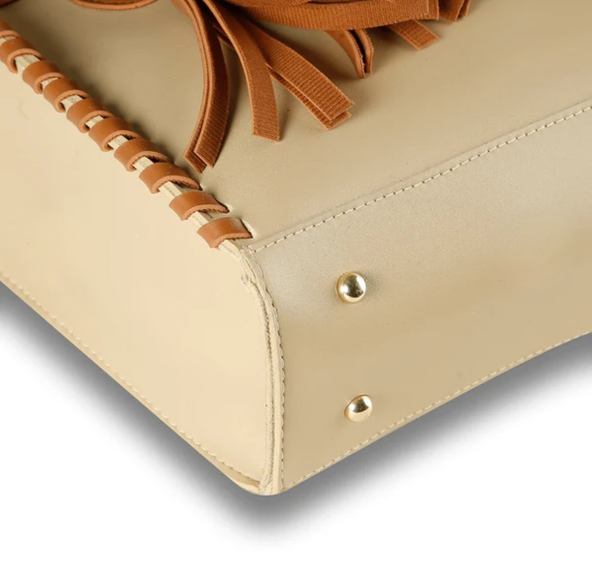 Soft, beautiful beige handbag with brown handles and tassels