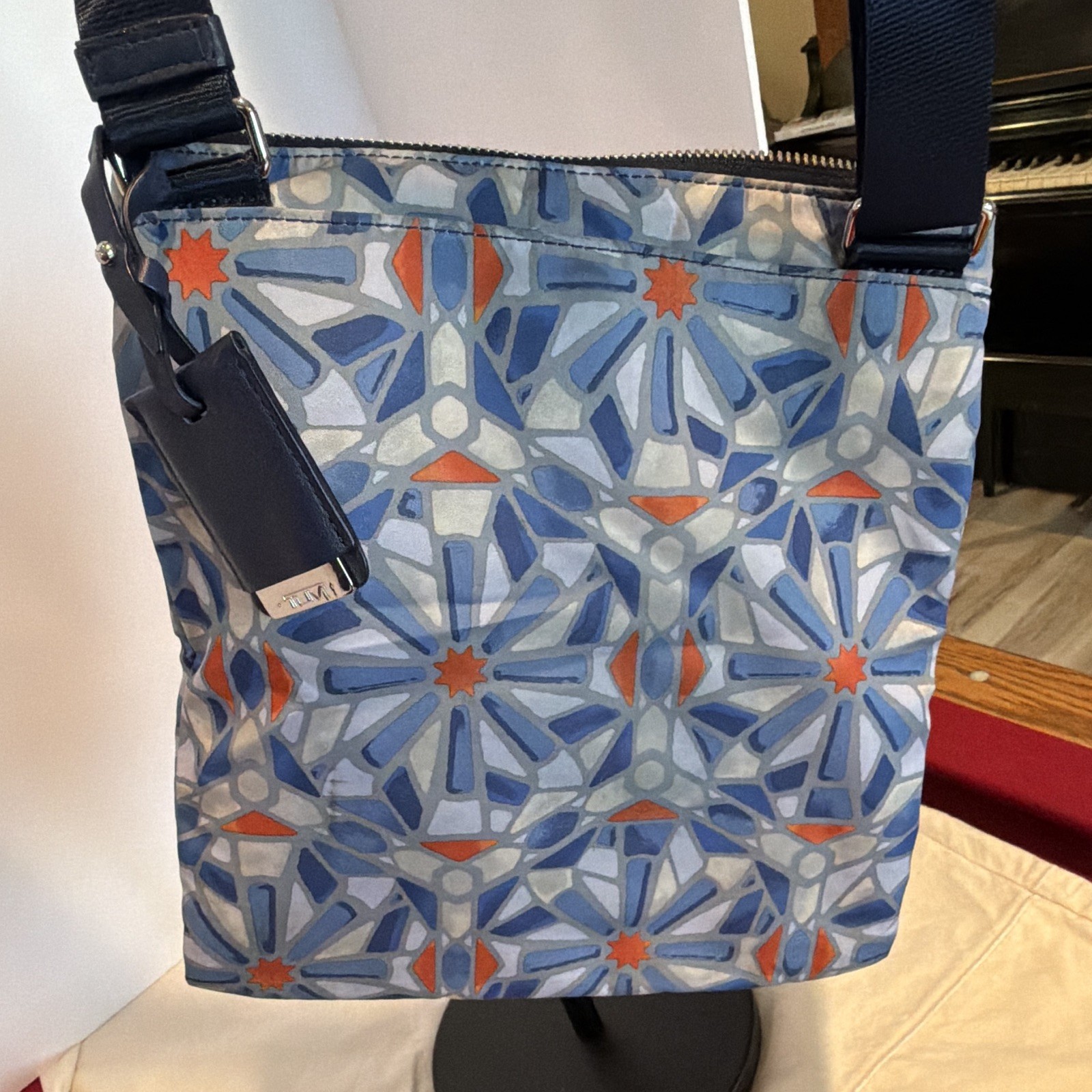 TUMI Blue Orange Geometric Crossbody Bag Adjustable Strap Lined Pockets Zip