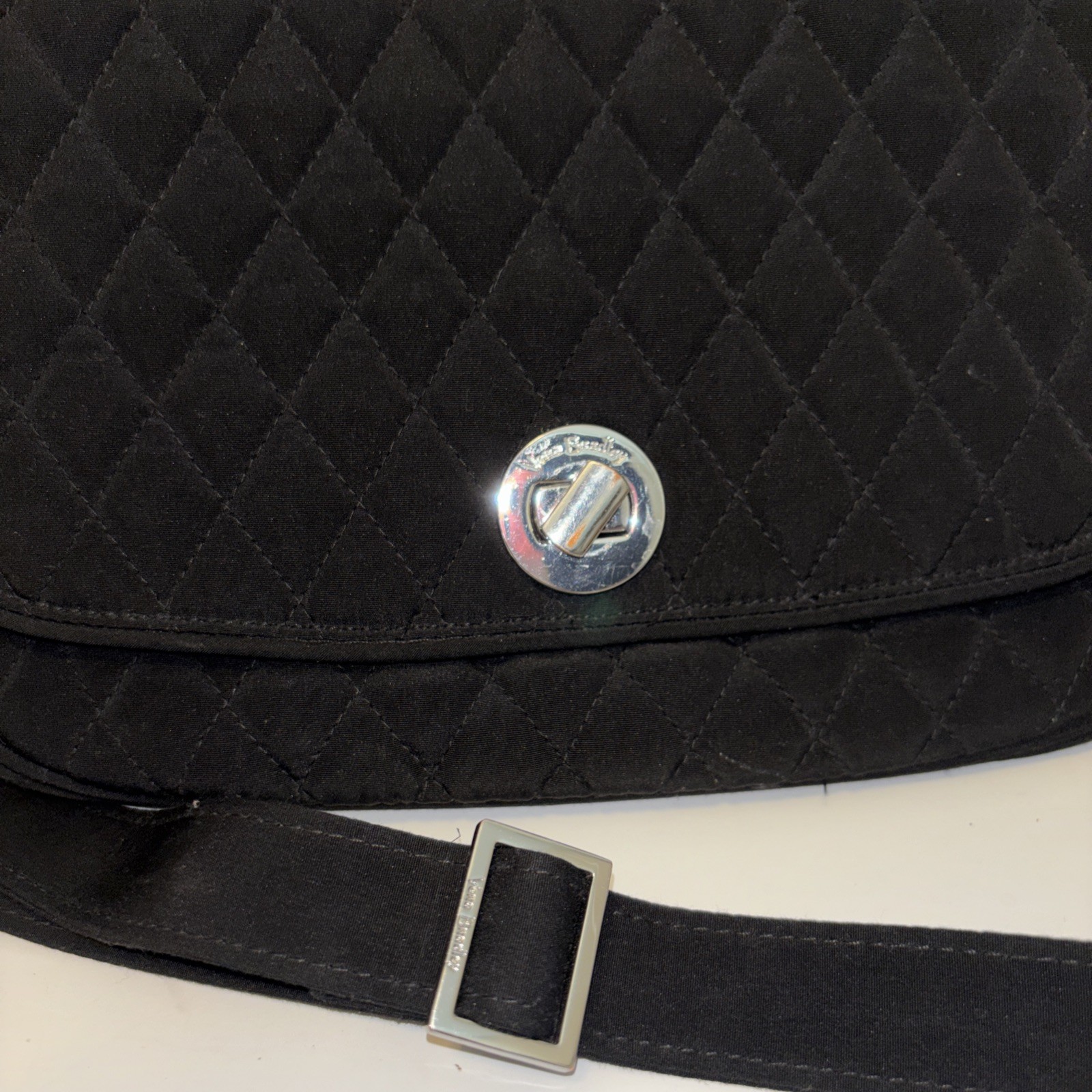Vera Bradley black quilted crossbody bag,turn-lock closure on the front flap