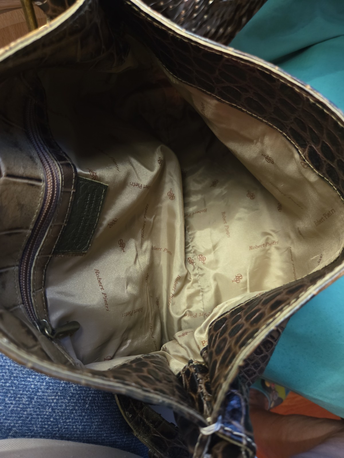 This is a Robert Pietri GENUINE LEATHER tan Crock Enbossed Bag