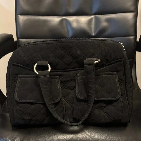 Black Vera Bradley Quilted Hand Bag with two pockets on front and 2 straps