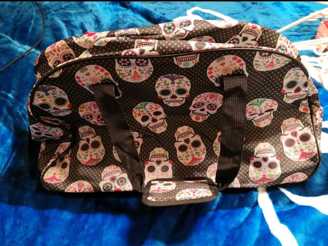 Betsey Johnson Skull Party Rolling Carry-On Bag, Skull Print, Tag & Charm