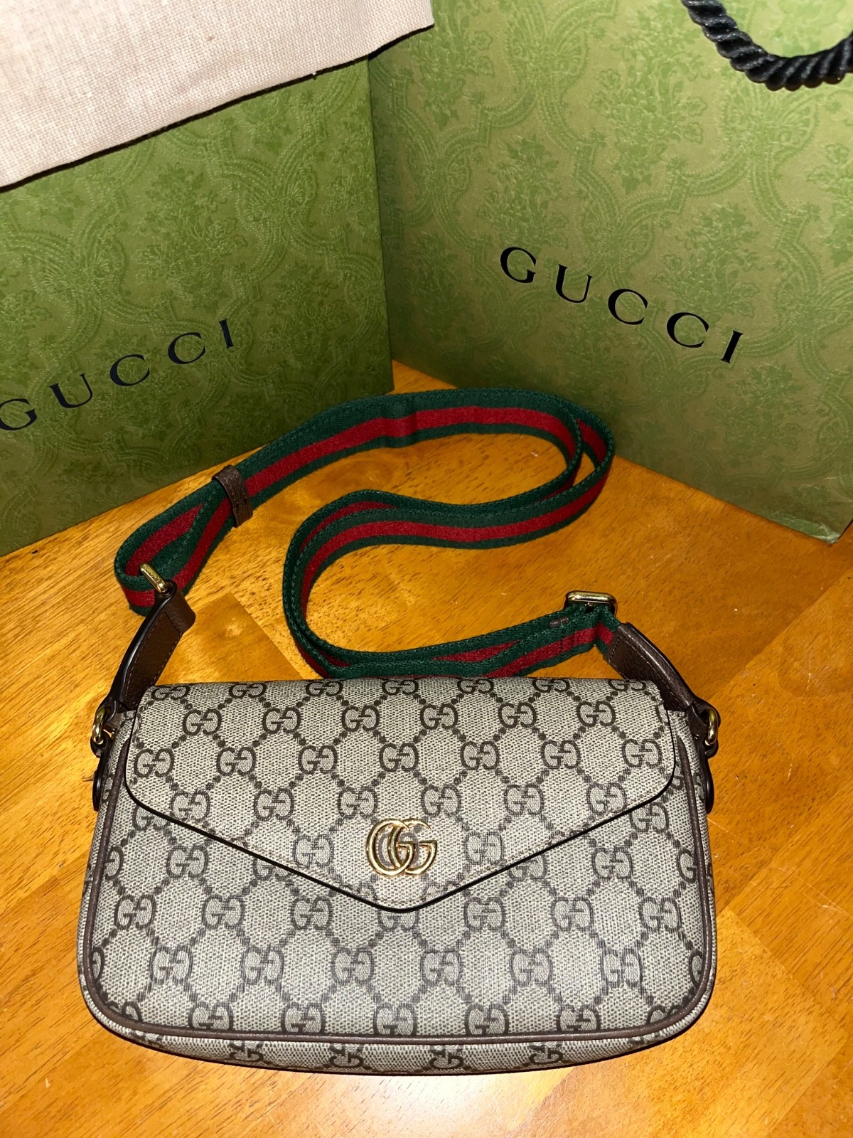 Authentic Gucci Ophidia Pochette in Beige & Ebony Supreme GG Canvas variation