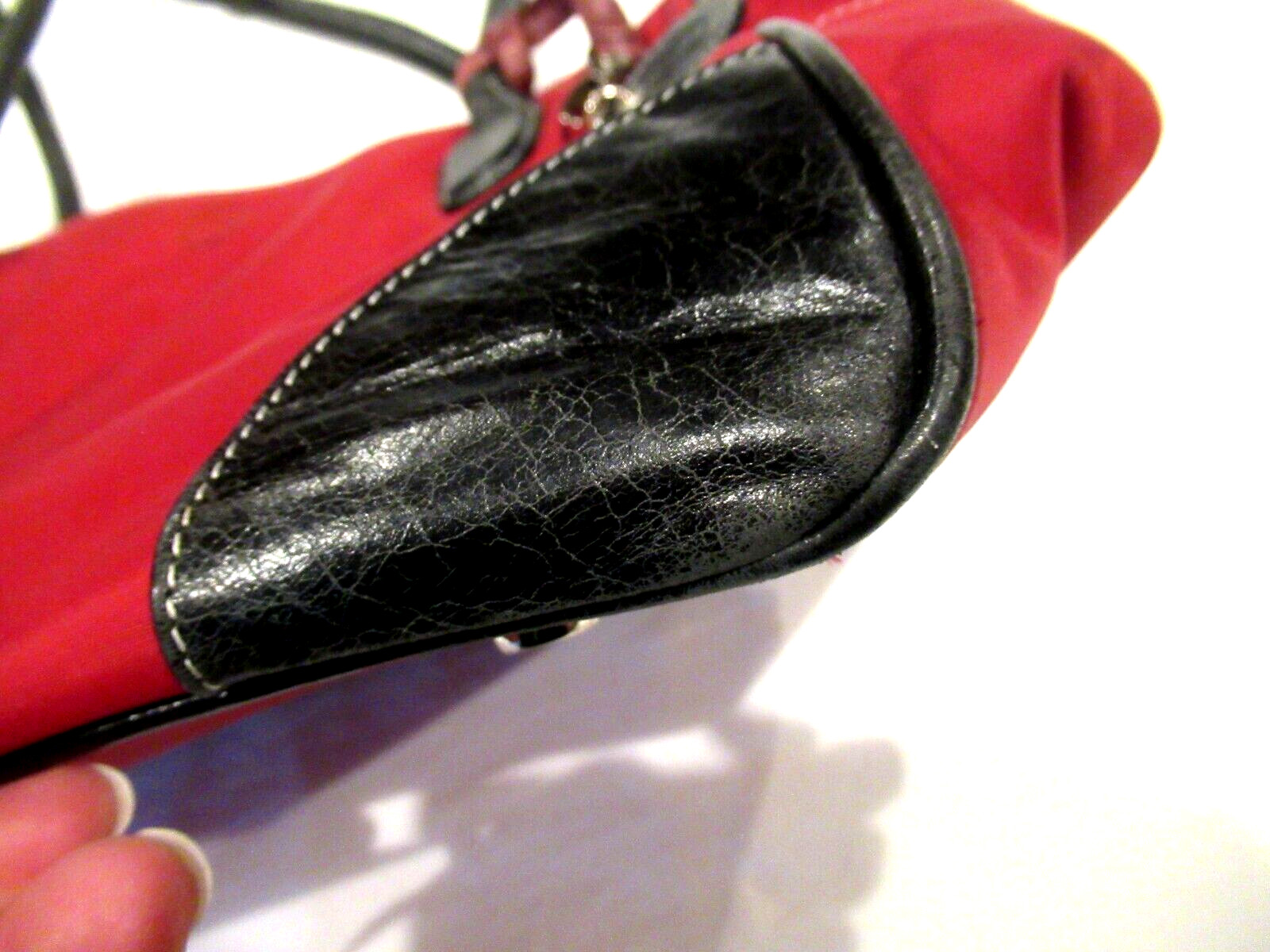 Chelsey Henry red purse with black trim, lots of pockets