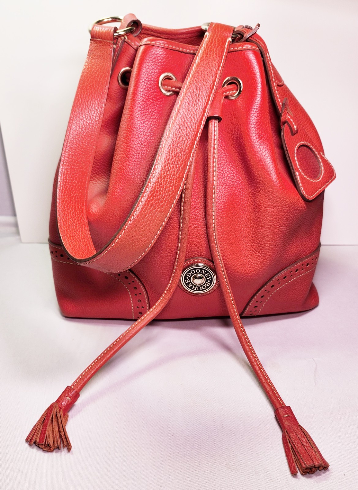 Dooney & Bourke Pebble Leather Red Tassel Satchel • Raised Button Logo J7343515