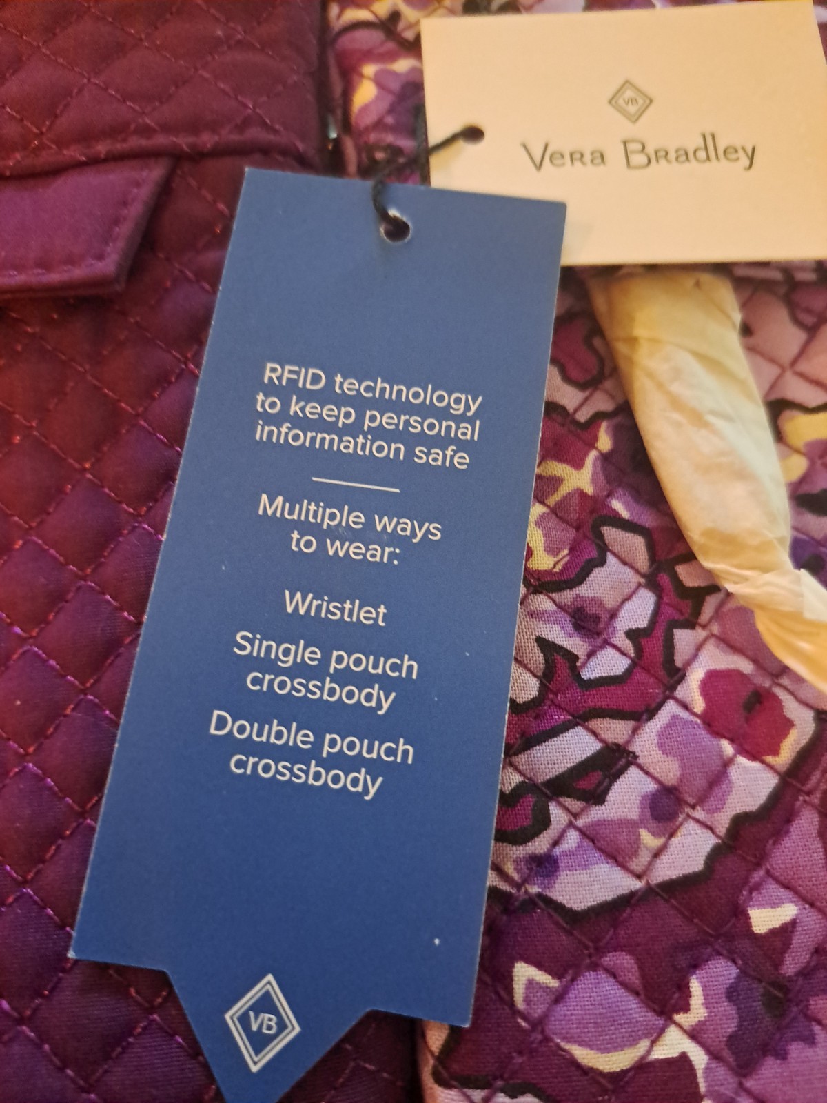 new vera bradley RFID crossbody/wristlet, lilac paisley/purple. New/tags on.