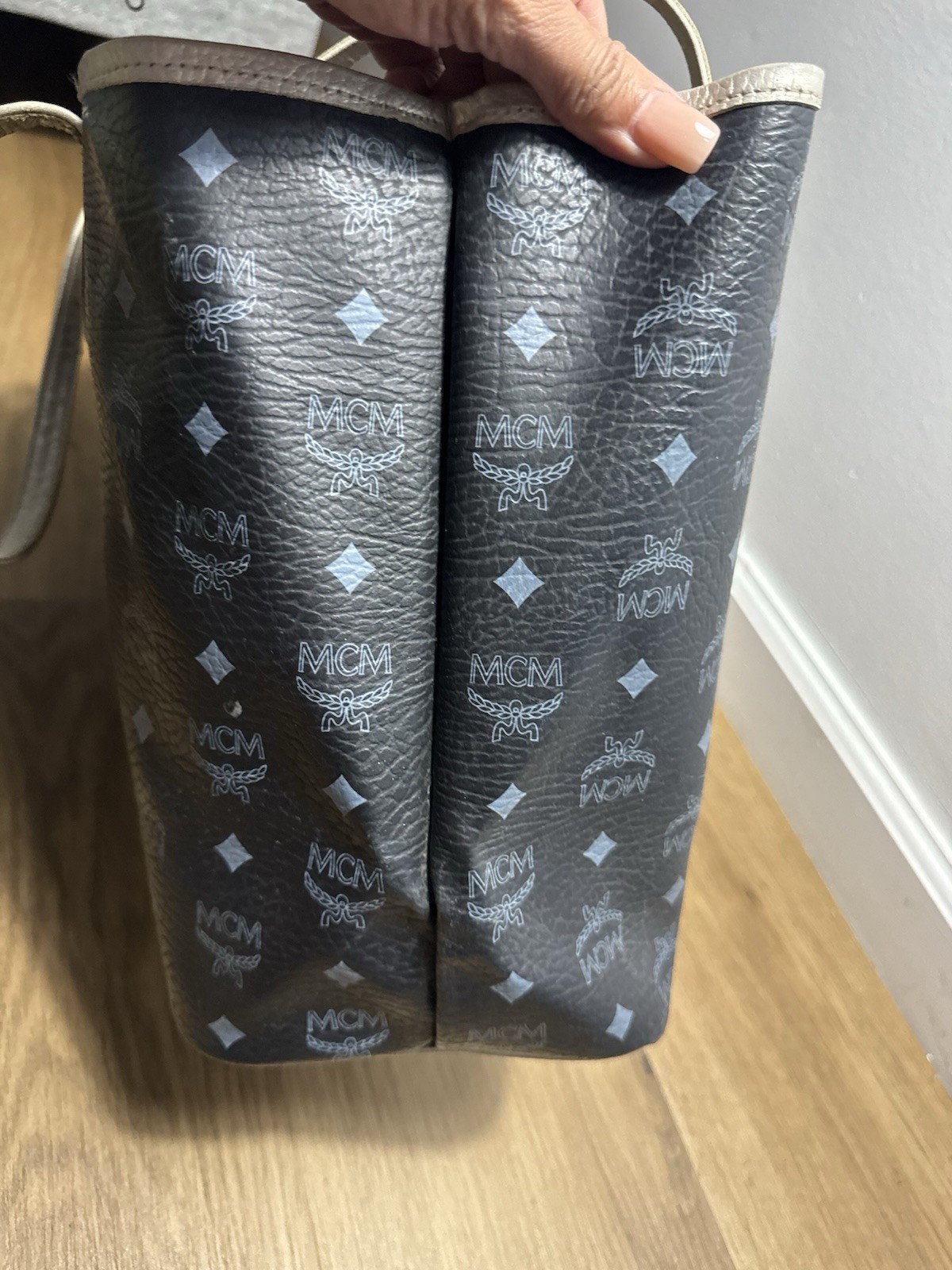 MCM black & gray tote bag with repeating white MCM logo and diamond pattern