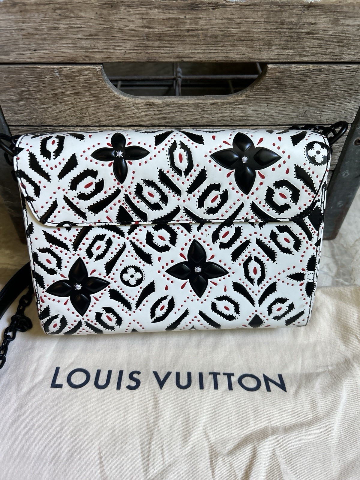 LOUIS VUITTON “Twist” black white red graphic print leather MM handbag