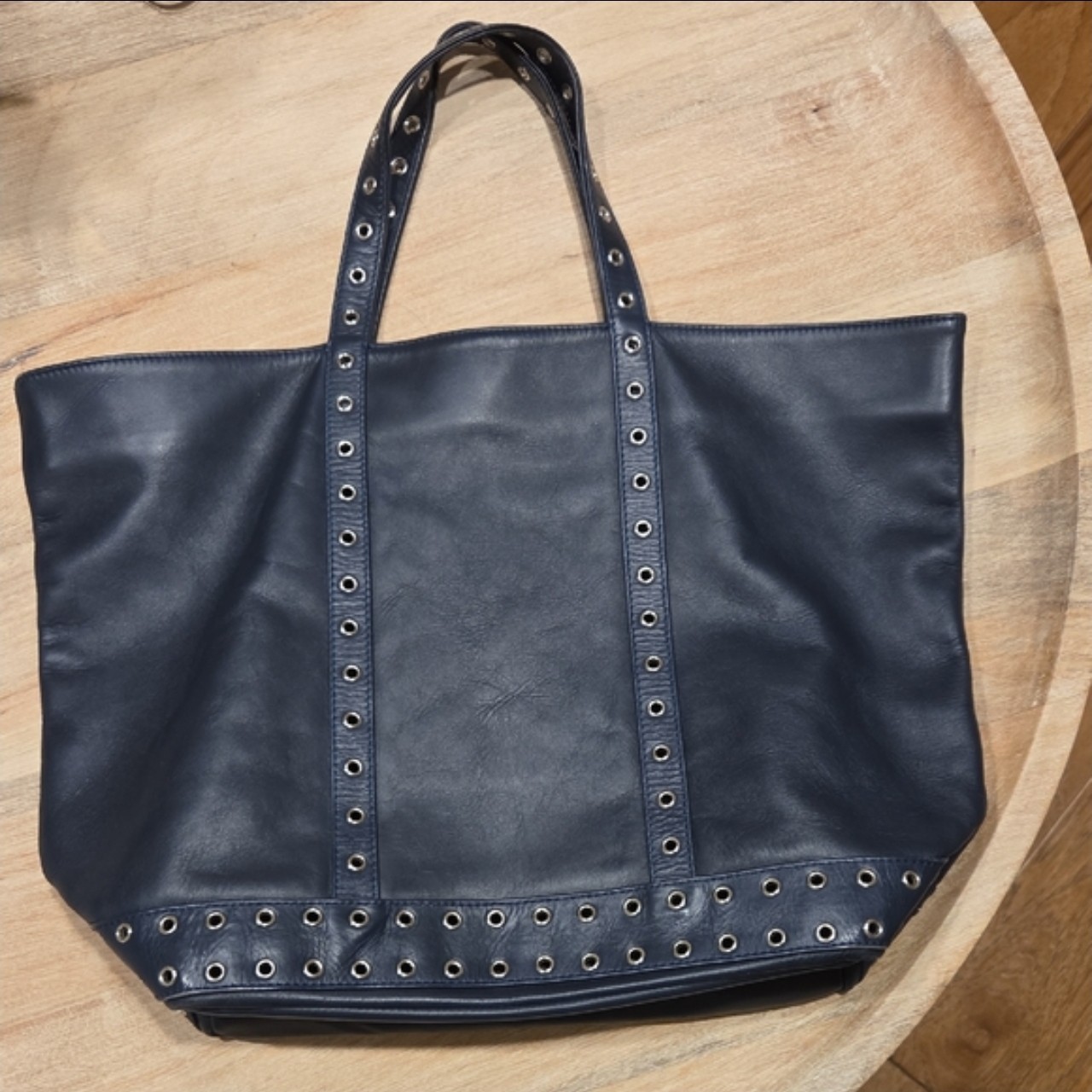 Iconic Vanessa Bruno medium Le Cabas shopper with metal ring details.