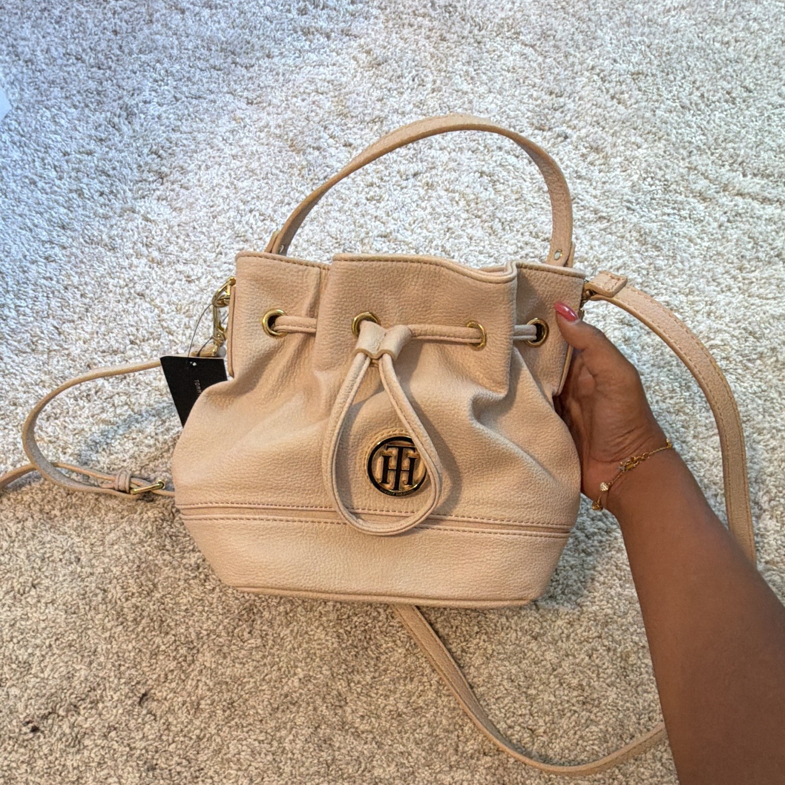 Tommy Hilfiger Beige Drawstring Bucket Bag Tassel Logo Charm Gold Hardware