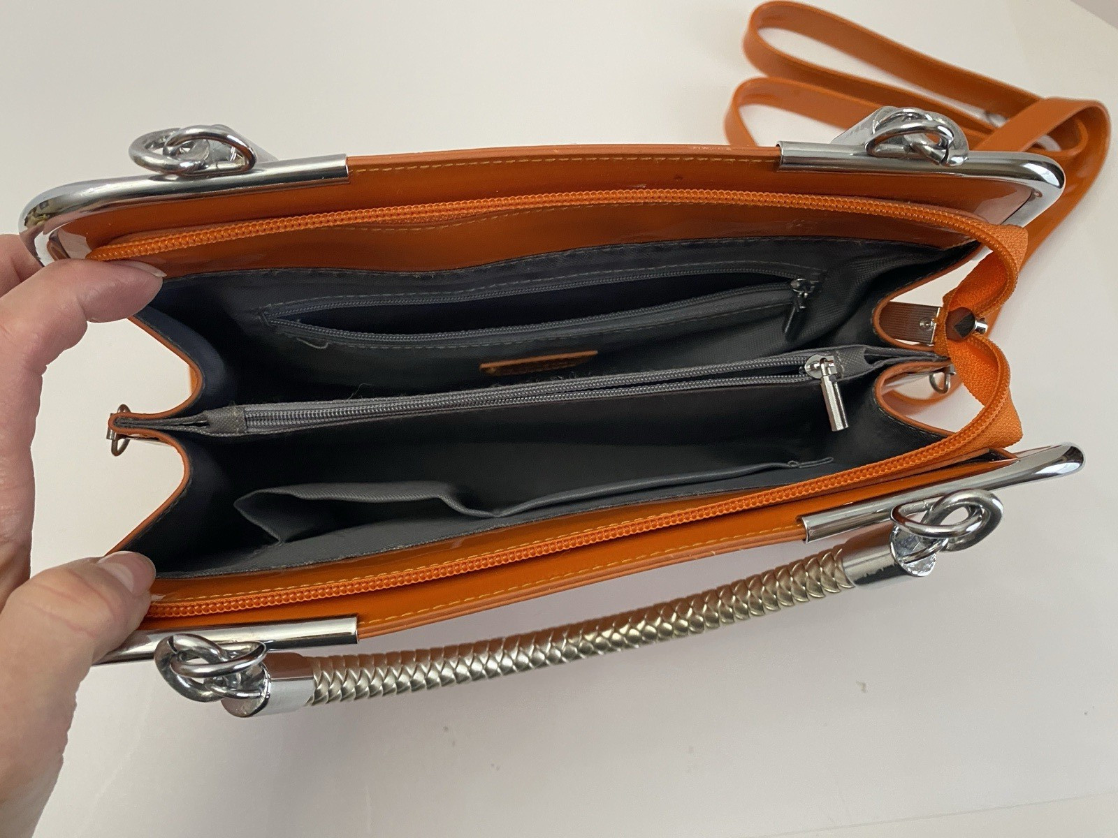 MC Collection handbag Glossy Orange with Braided silver handle and strep Pre own
