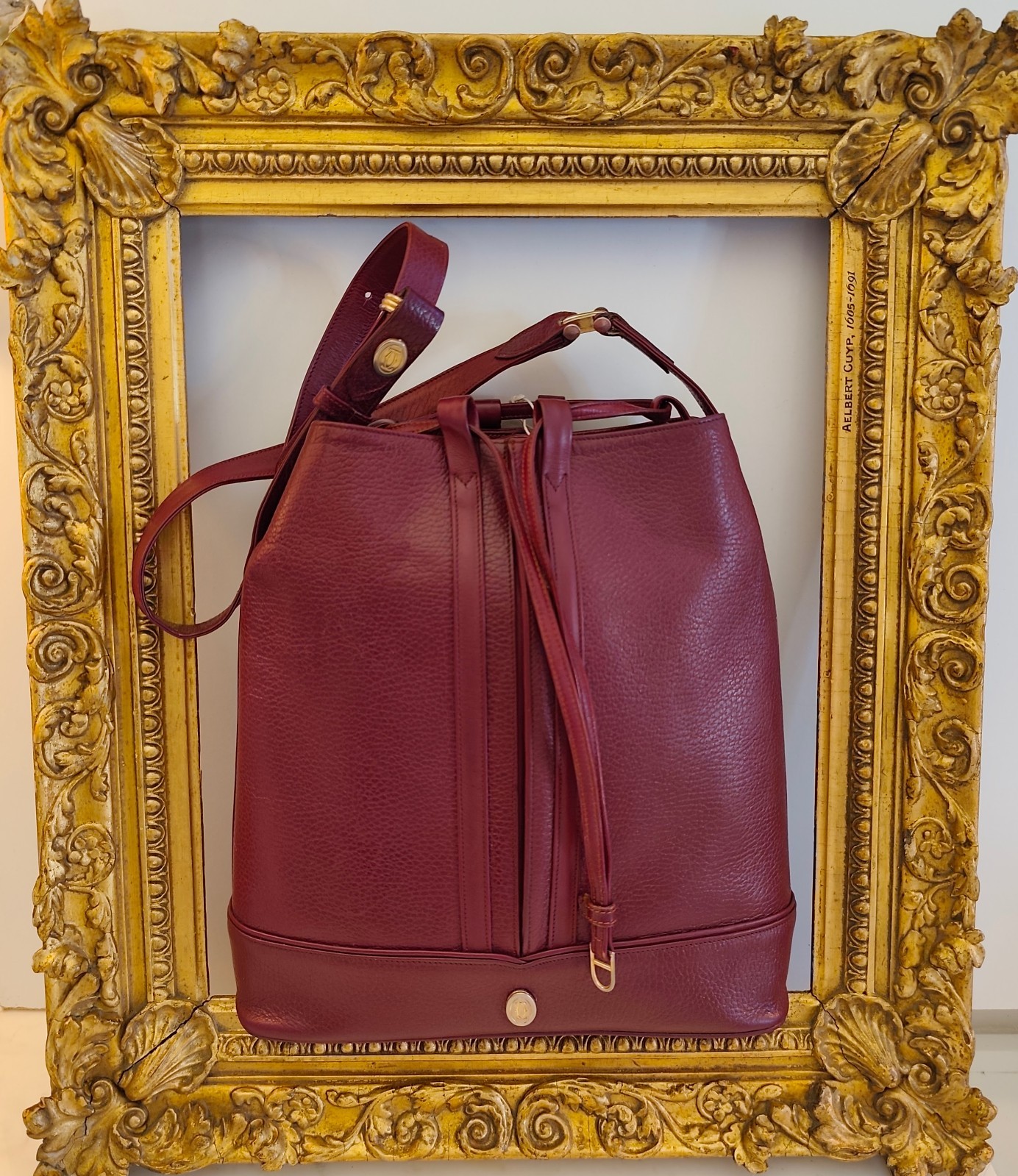 Cartier Oval Bucket Bag With Drawstring In Bordeaux Leather, 30x28x10 cm