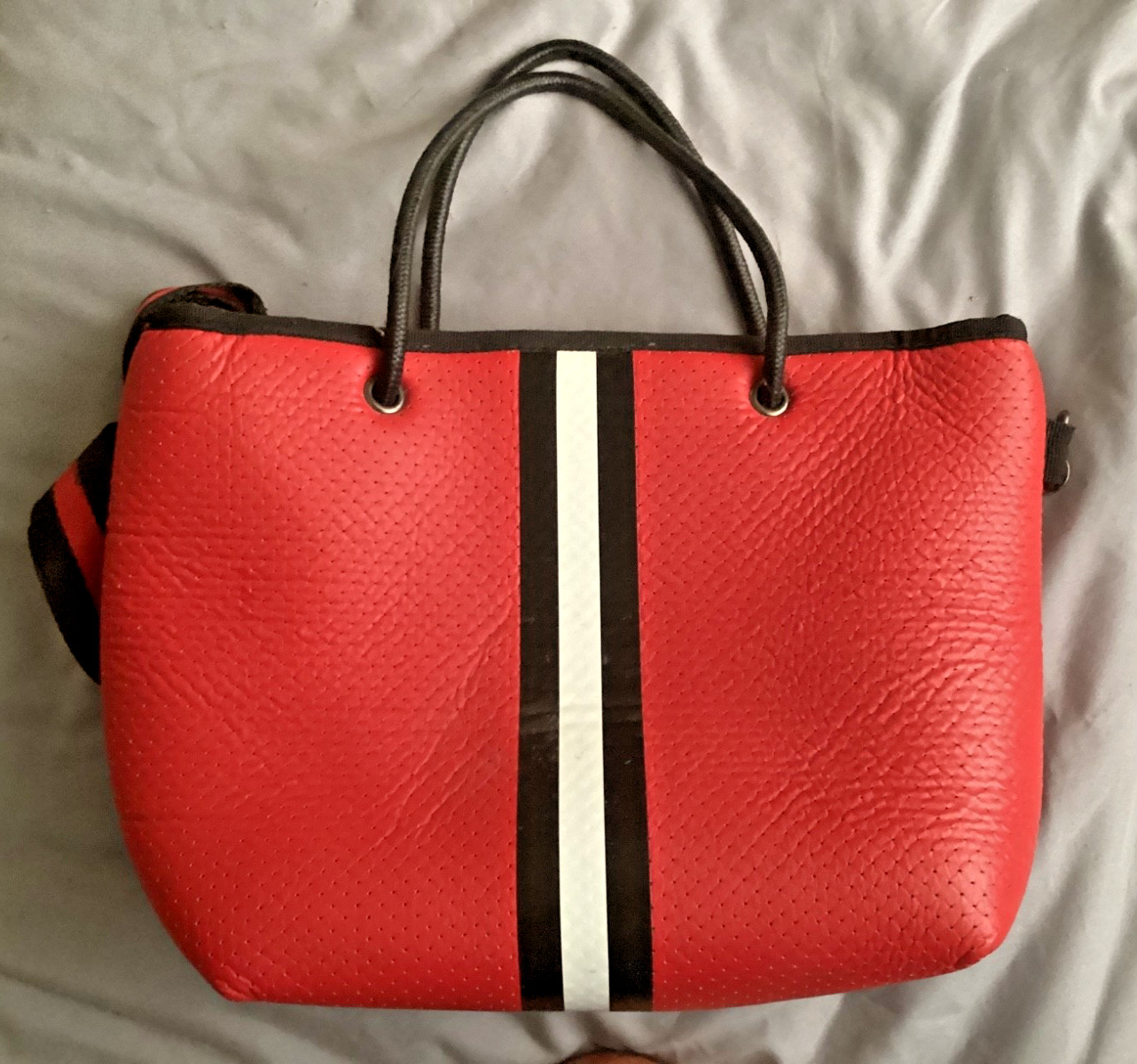 haute shore red purse with black and white stripe