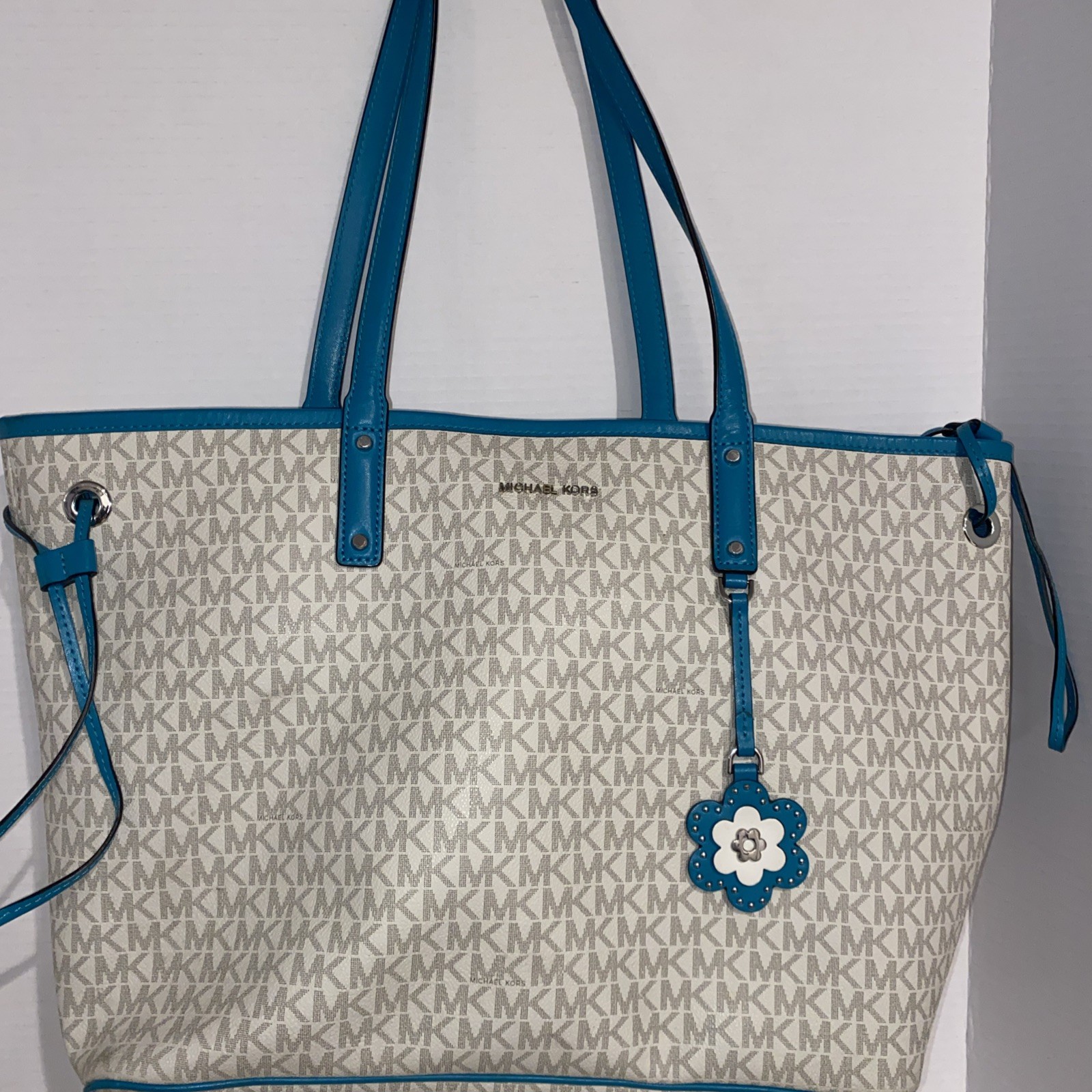 Michael Kors white Tote Bag with blue trim and Flower Charm/ M.K. Carter Tote