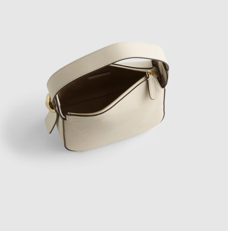 The Sculpted Metal Wristlet Bag